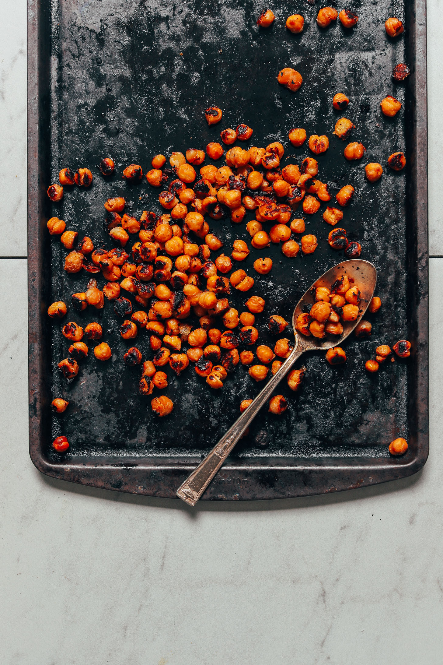 Baking sheet with a batch of our Crispy Miso Chickpeas for adding to bowls
