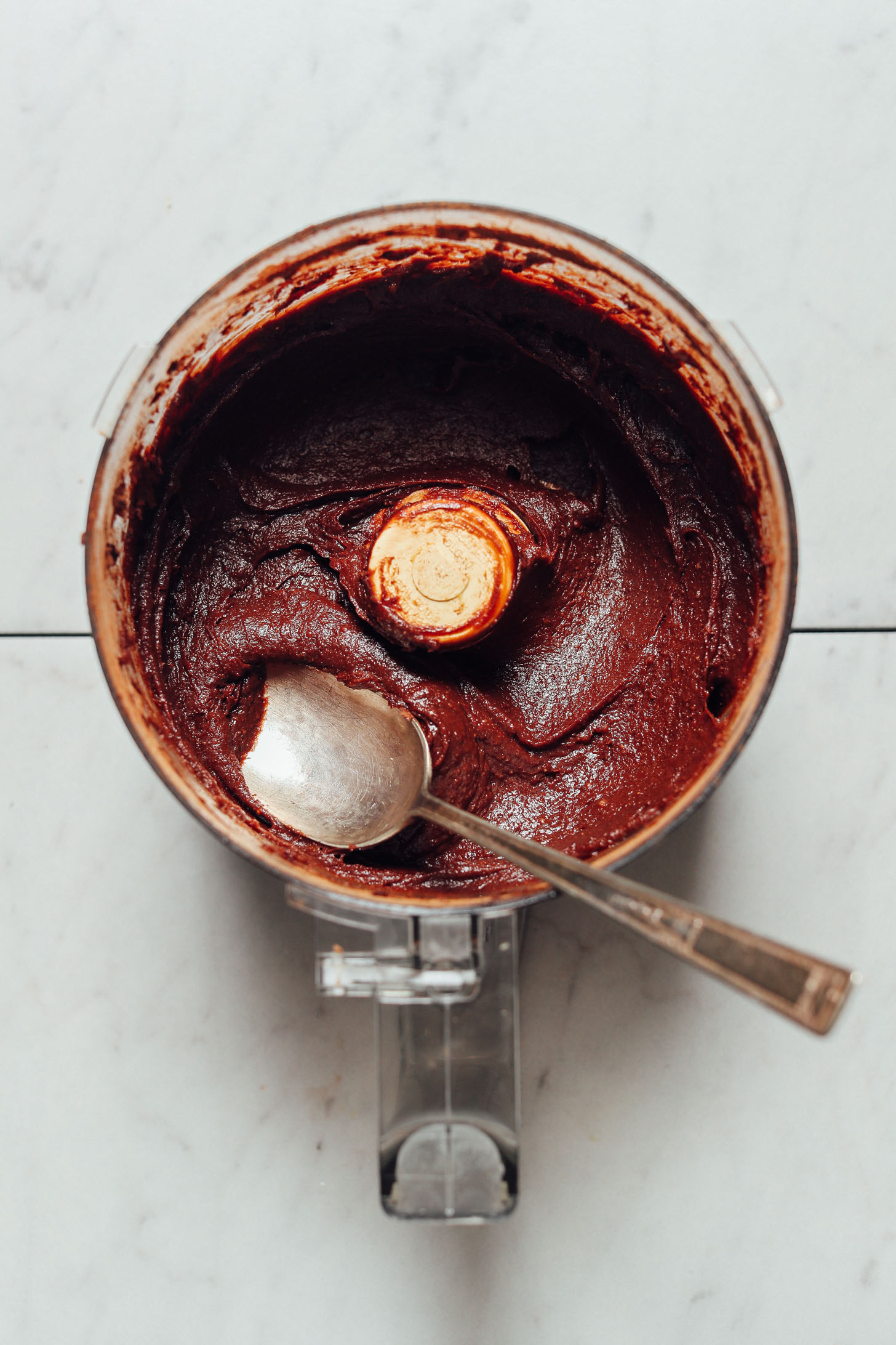 Fresh homemade Vegan Chocolate Frosting in a food processor