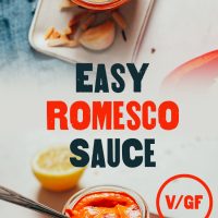 Top down and side shots of a jar of our Easy Romesco Sauce with text overlaid with the recipe title