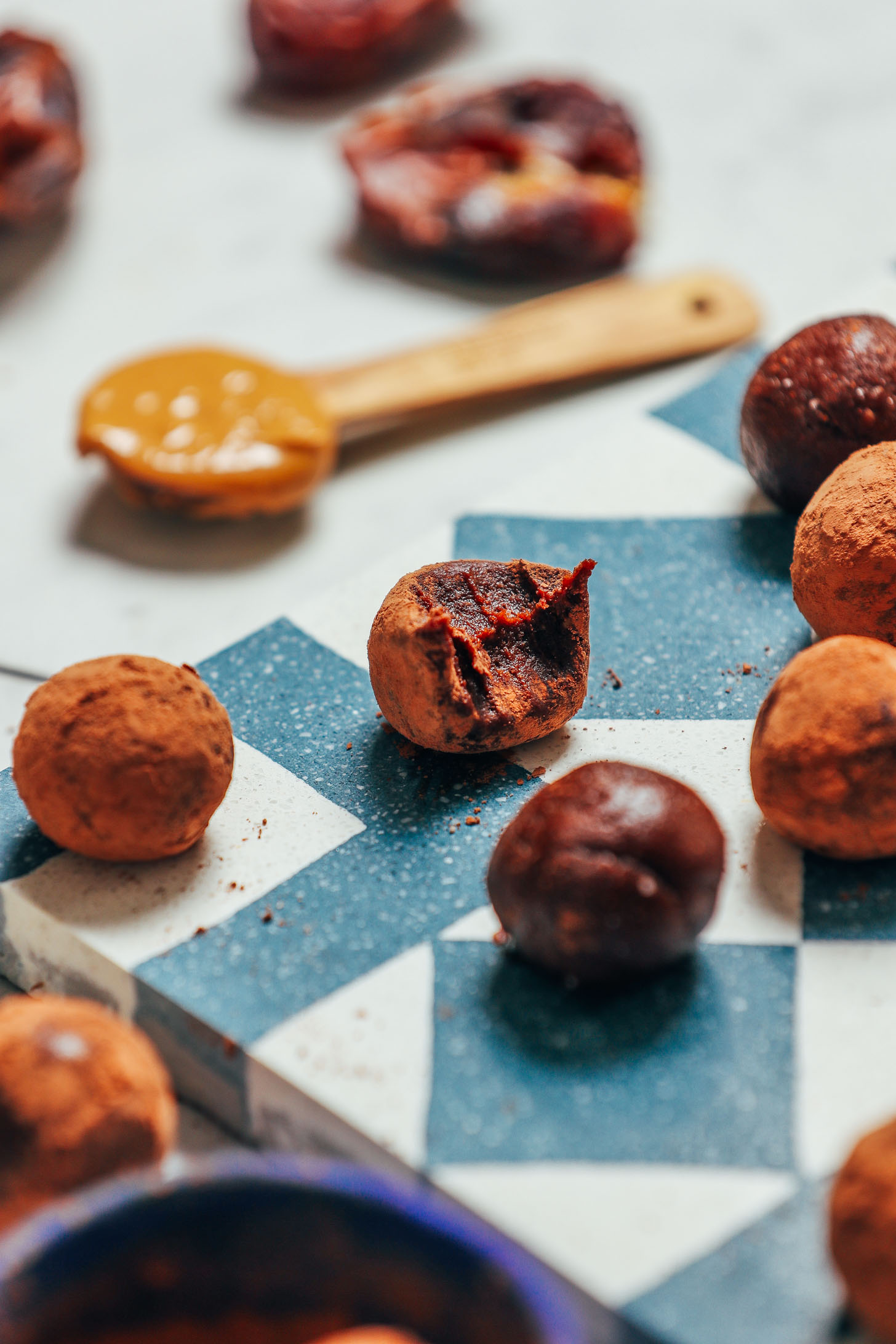 Date-sweetened Vegan Chocolate Truffles on a tile for a simple and delicious dessert