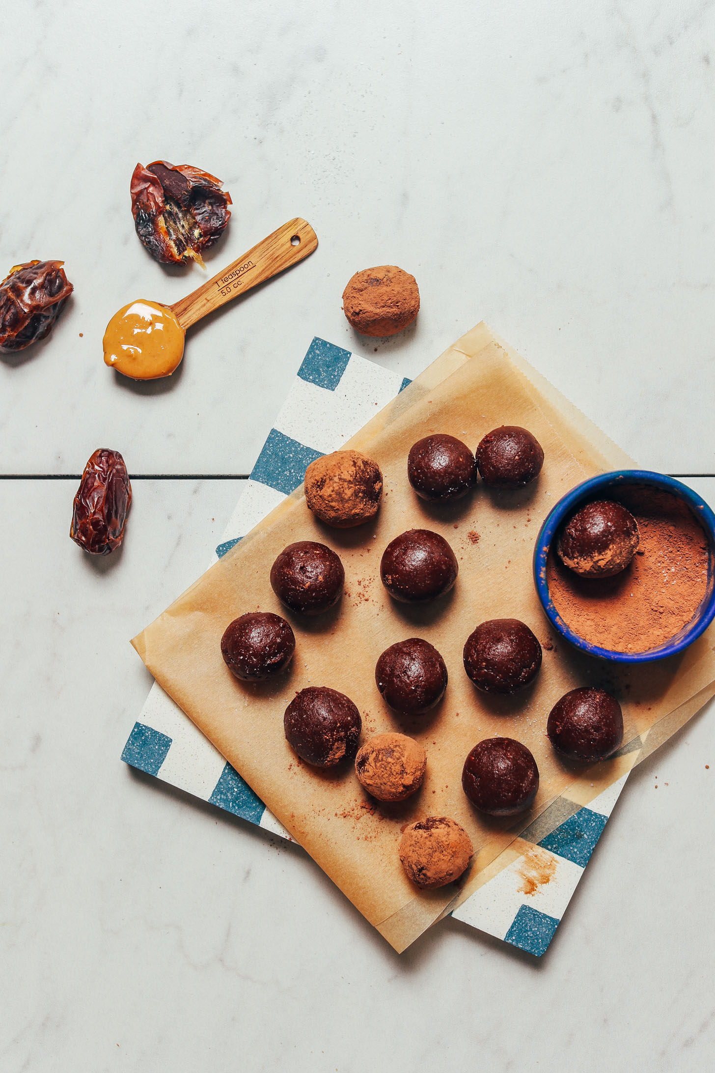 Dates, cashew butter, cacao powder, and a batch of freshly made Vegan Chocolate Truffles
