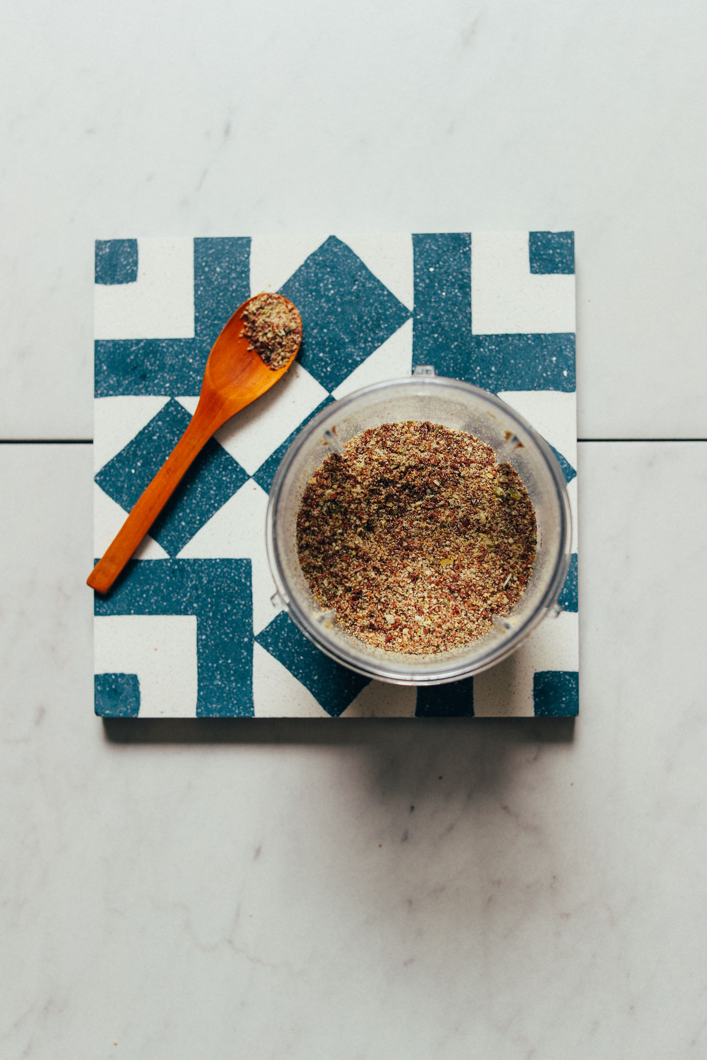 Spoon and bowl full of our follicular phase DIY seed cycling mix recipe