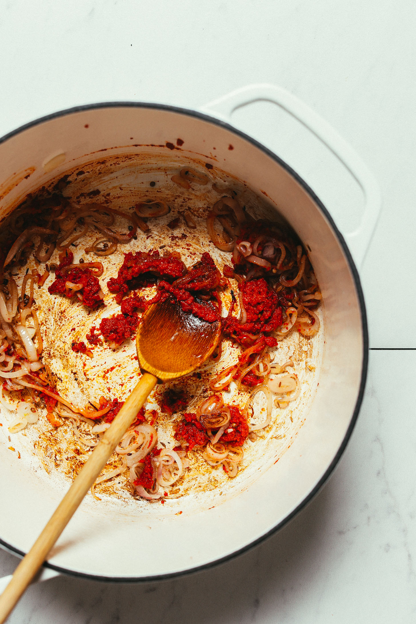 Sautéing shallot and curry paste in a big pot for our 1-Pot Massaman Curry recipe