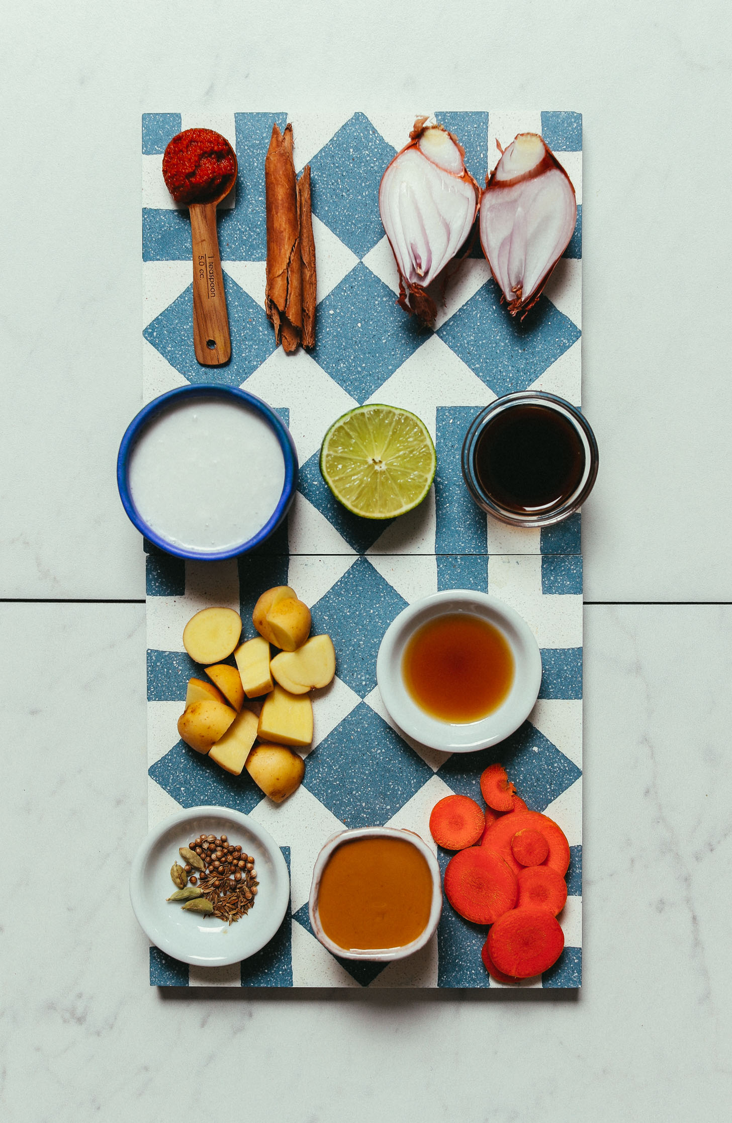 Tiles with ingredients for making our homemade vegan Massaman Curry recipe
