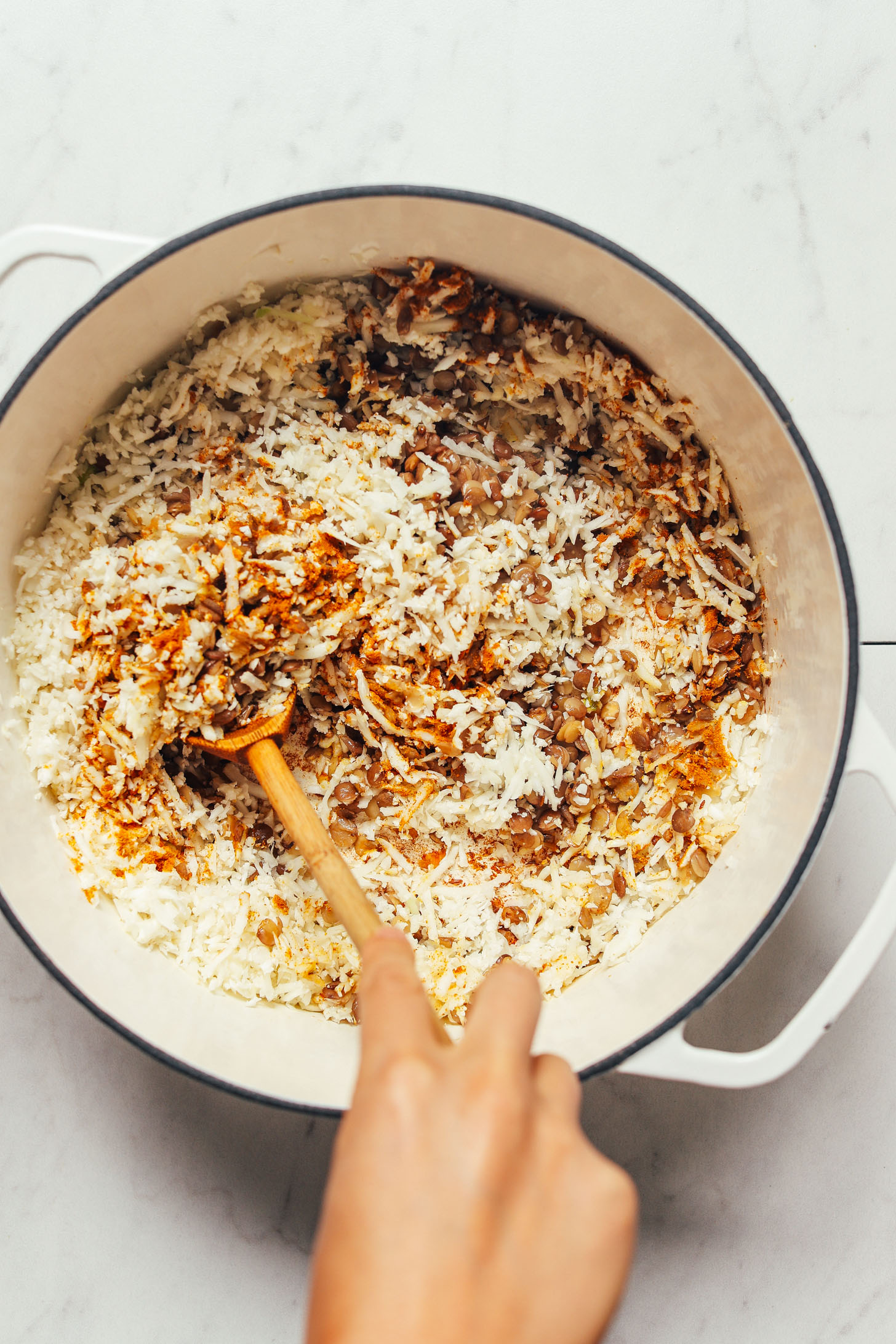 Cooking Curried Cauliflower Rice with lentils for our grain-free take on mujadara