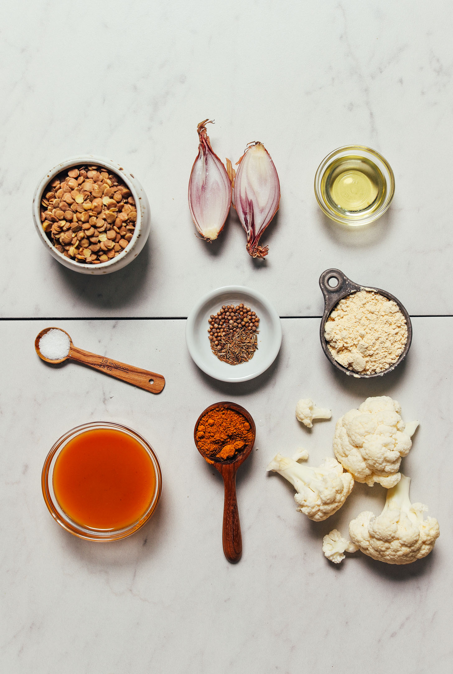 Cauliflower, lentils, shallot, and other ingredients for making our Grain-Free Curried Cauliflower Rice recipe