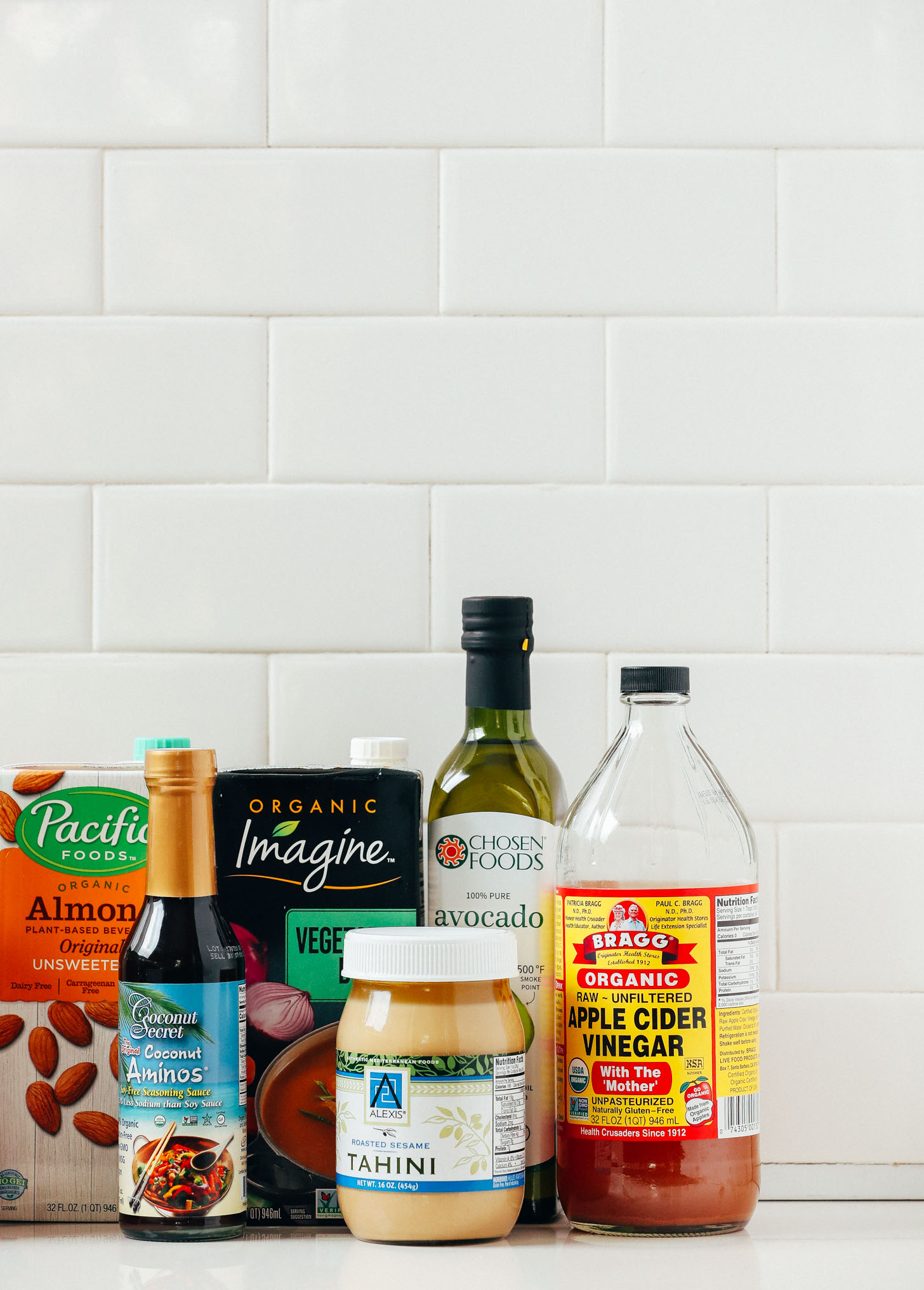Tahini, coconut aminos, and other condiments included in our guide on How to Stock Your Pantry