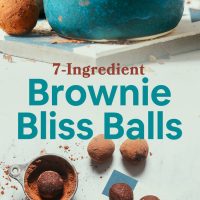 Tile and bowl filled with our simple Brownie Bliss Balls made with almond pulp