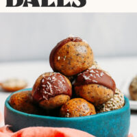 Bowl of our 5-Ingredient Protein Balls with text that says low sugar and 5 ingredients