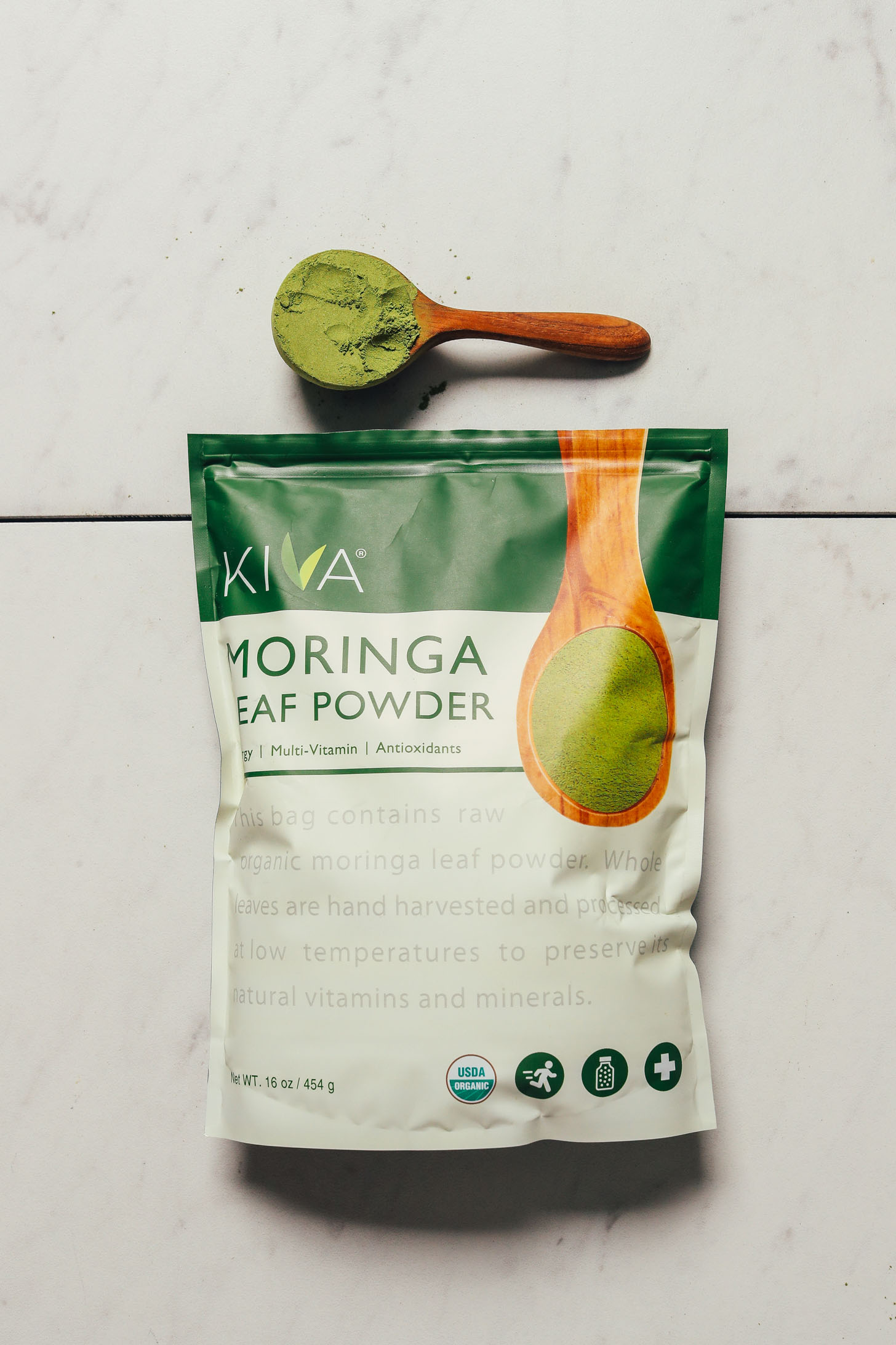 Package and spoonful of Kiva Moringa powder for our review of the best moringa powder brands