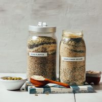 Jars of our luteal and follicular phase seed cycling mixes for hormonal balance