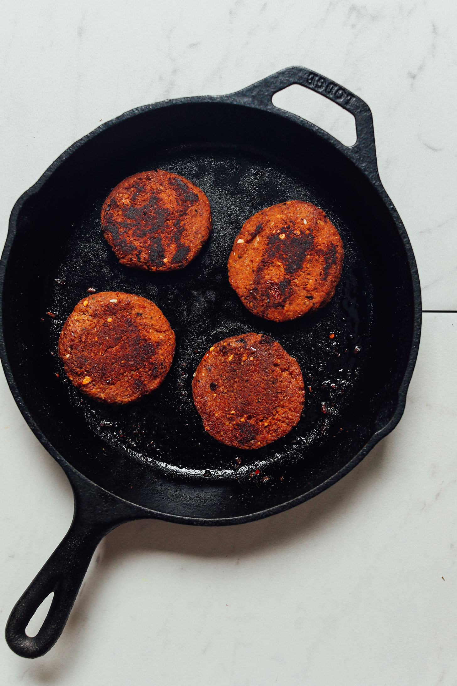 Cooking homemade Vegan Sausages in a skillet