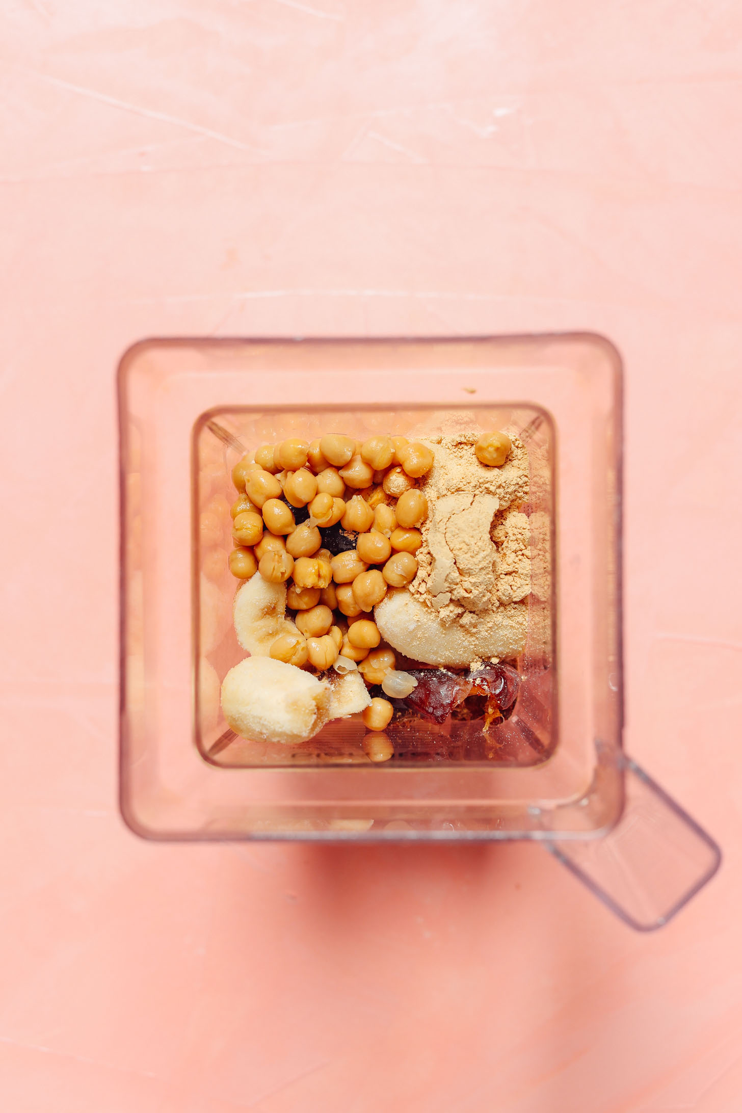 Blender filled with ingredients for making our Creamy Peanut Butter Chocolate Shake recipe