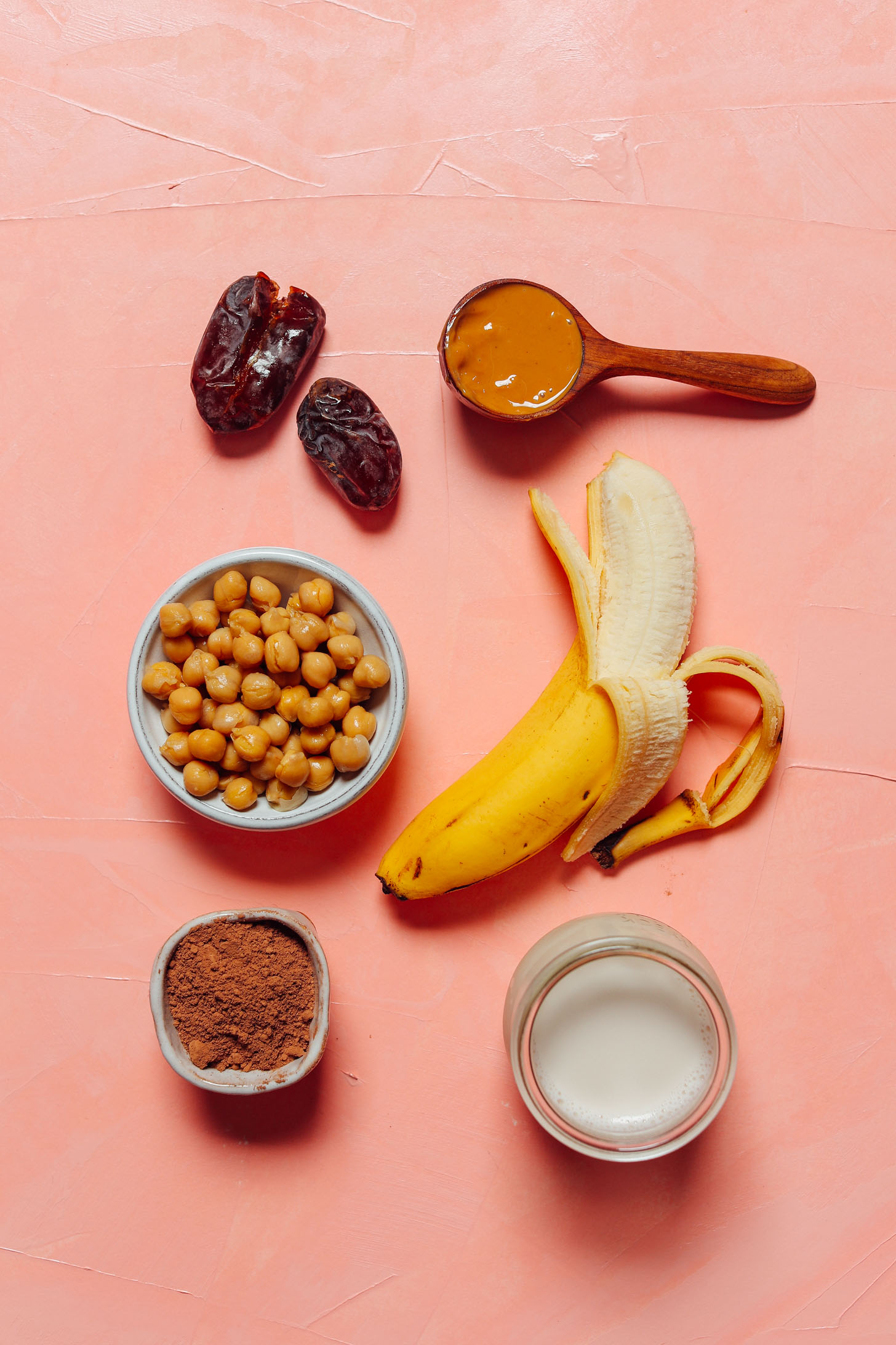 Bananas, chickpeas, dates, and other ingredients for making a Vegan Chocolate Chickpea Shake recipe