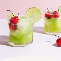 Two glasses of Citrus Melon Spritzers with cherries for a refreshing summer drink