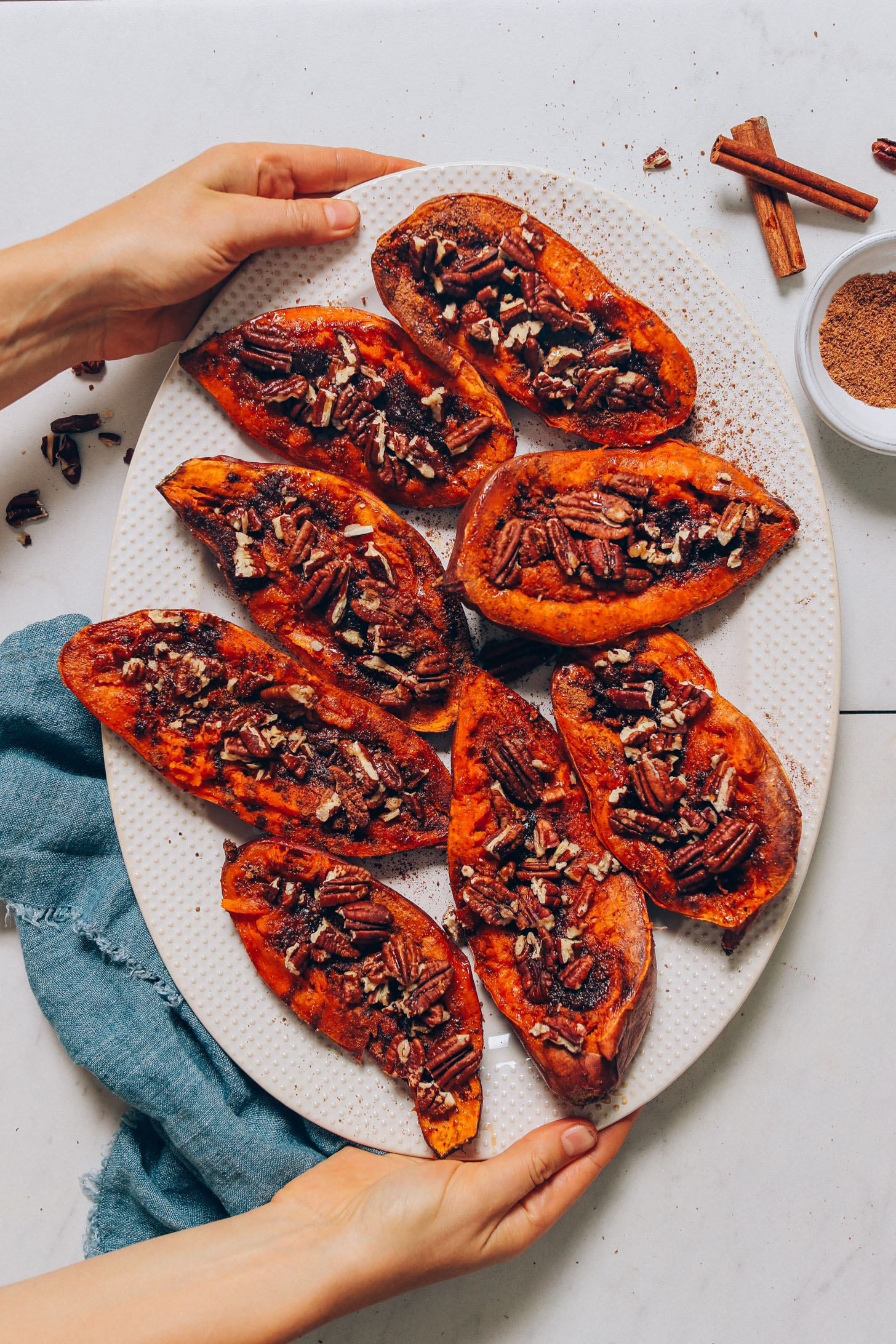 Platter of Sweet Potato Casserole Boats with coconut sugar, cinnamon, and pecans
