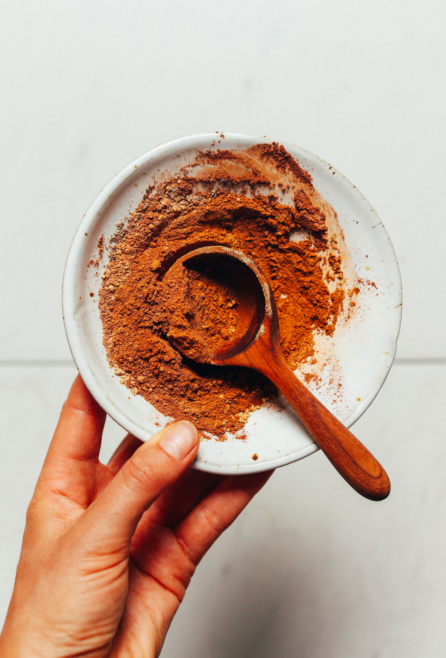 Holding a bowl of our Homemade Pumpkin Pie Spice recipe