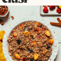 A pie pan of our raw vegan fruit crisp ready in just 10 minutes