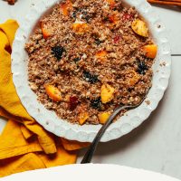Pie pan filled with our Raw Fruit Crisp recipe made with peaches and blackberries