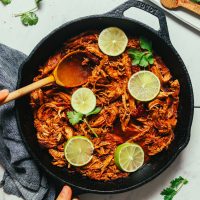 Pan of Shredded Mexican Chicken cooked in a cast iron skillet