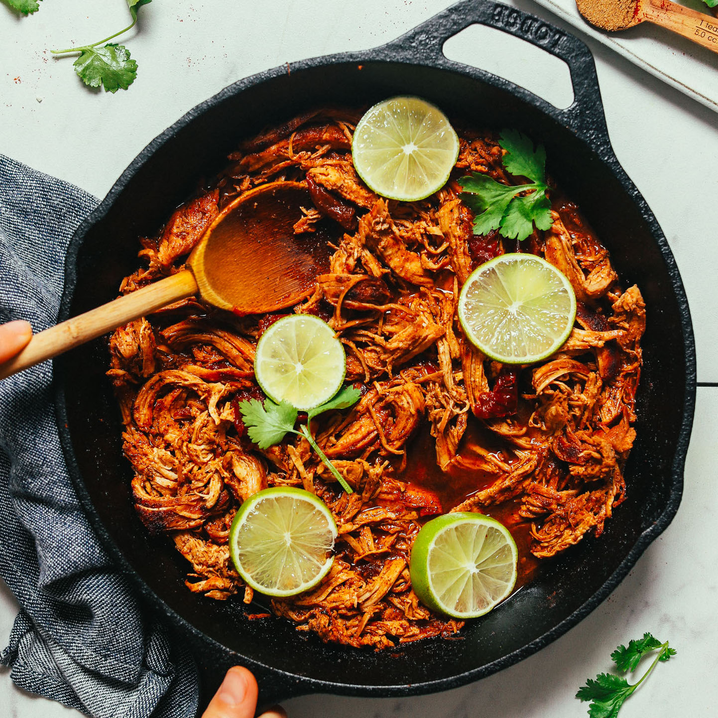 Pan of Shredded Mexican Chicken cooked in a cast iron skillet