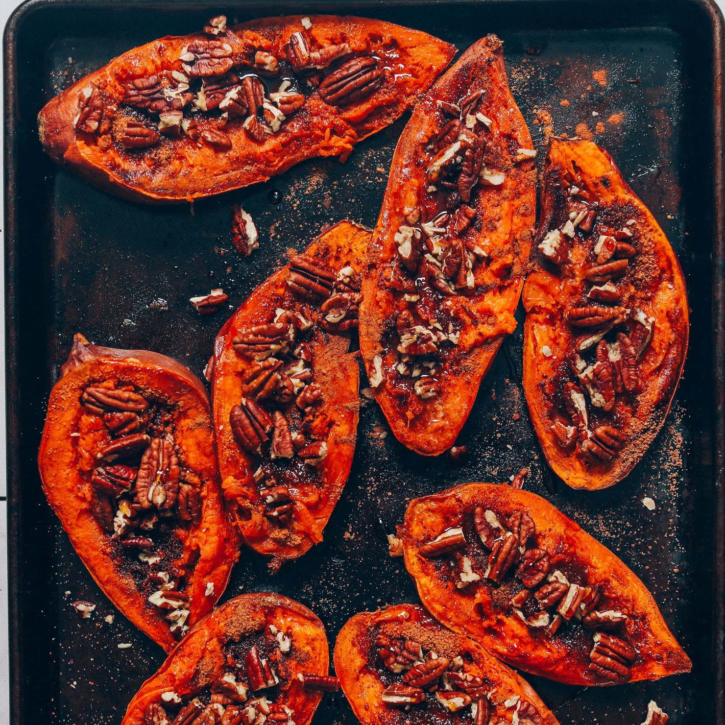 Baking sheet filled with Sweet Potato Casserole Boats for Thanksgiving