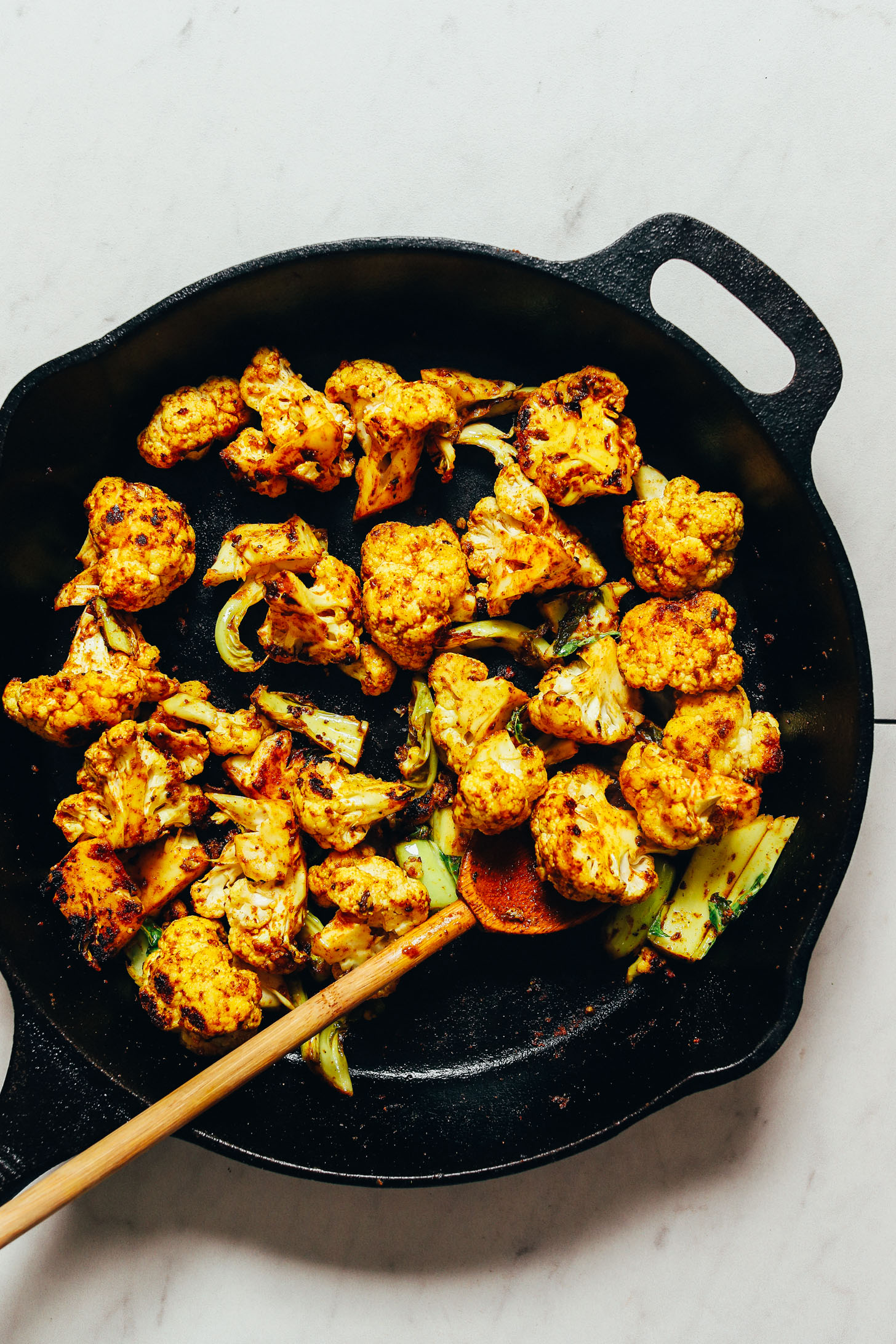 Pan of Quick Crispy Cauliflower seasoned with curry powder