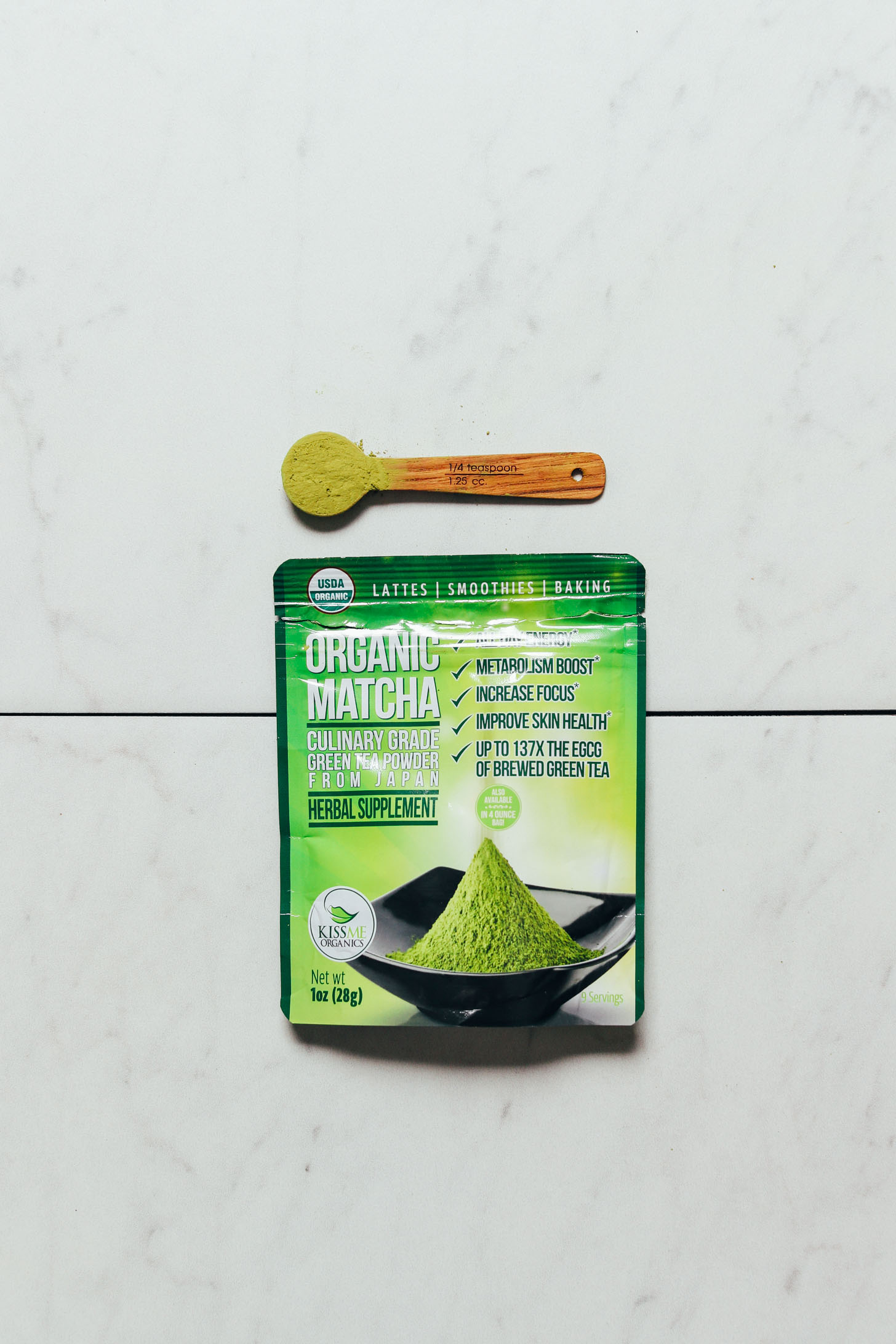 Packet and spoonful of Kiss Me Organics Culinary Matcha for our roundup of the best brands of matcha powder