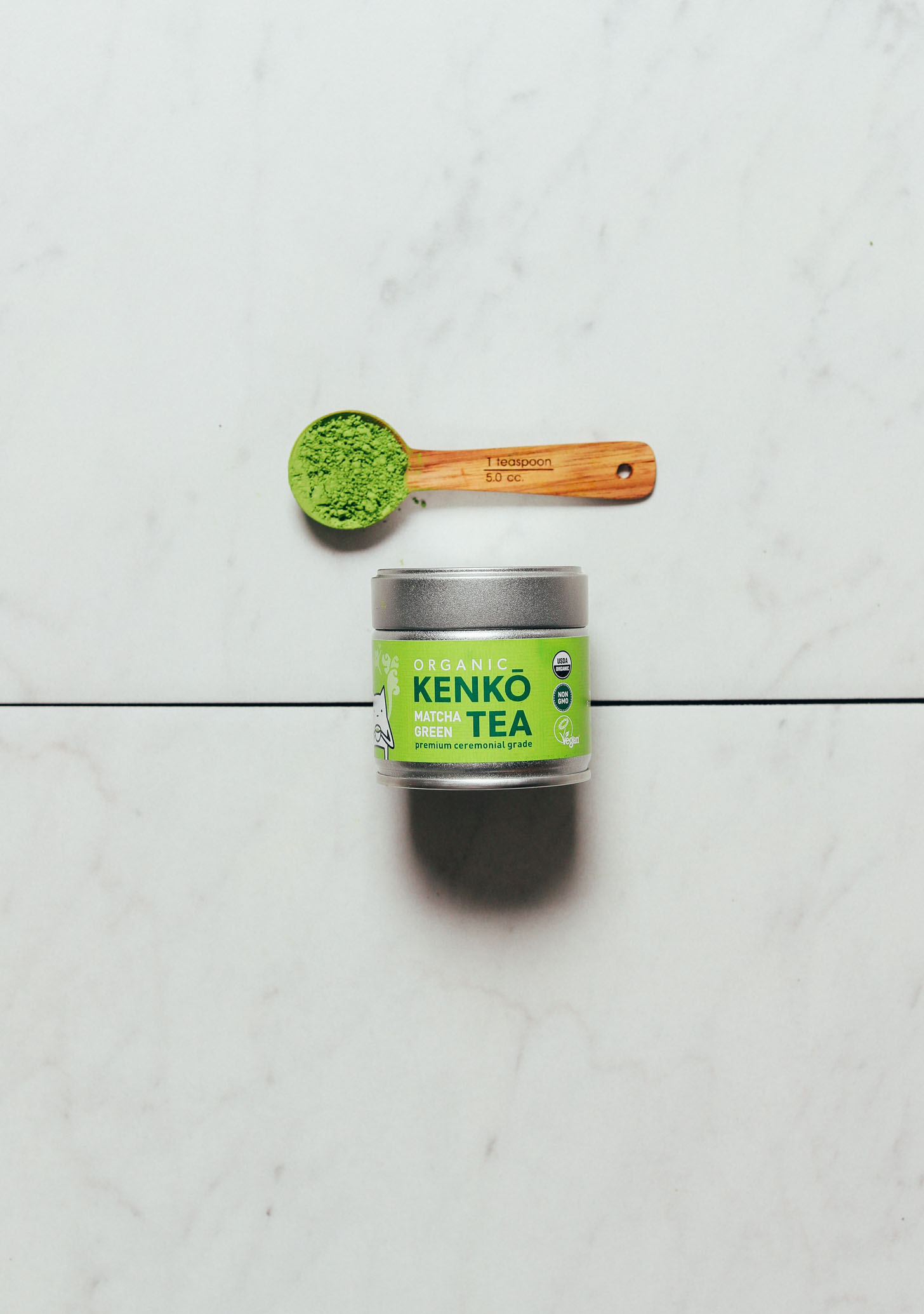 Spoon and jar of Kenko ceremonial matcha for our review of matcha brands