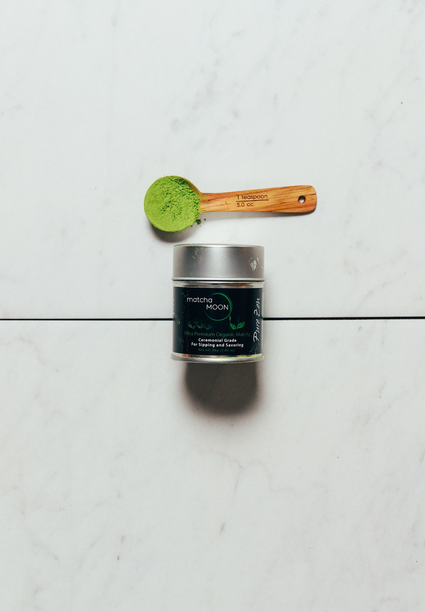 Spoonful and jar of Matcha Moon for our review of the best brands of ceremonial matcha