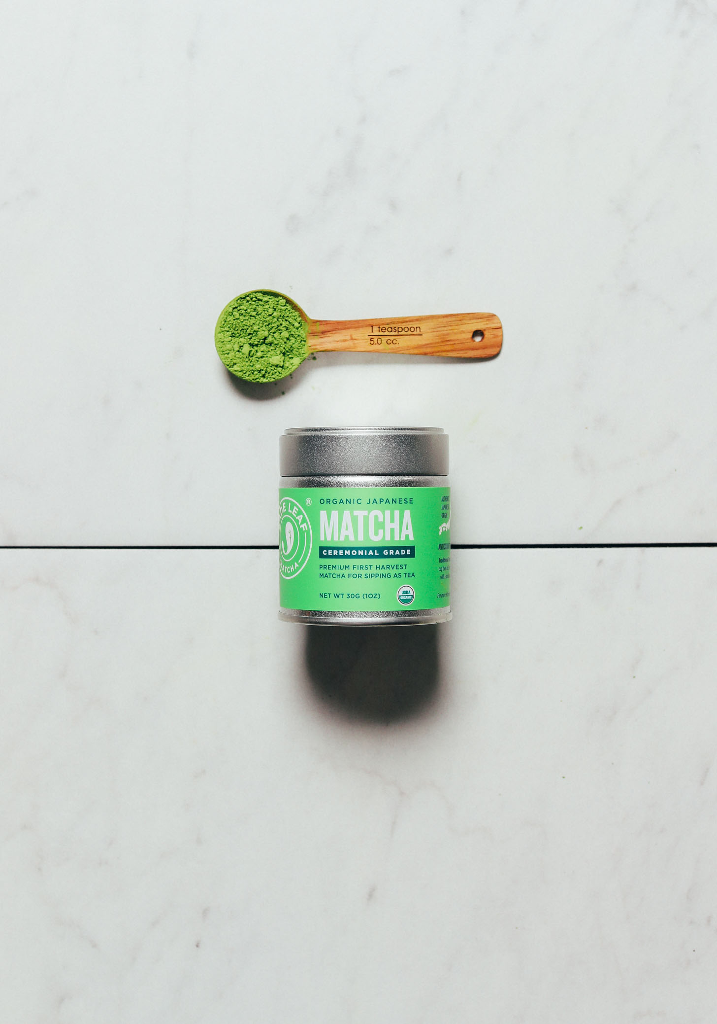 Spoonful and jar of Jade Leaf Ceremonial Matcha for our review of the best brands of matcha