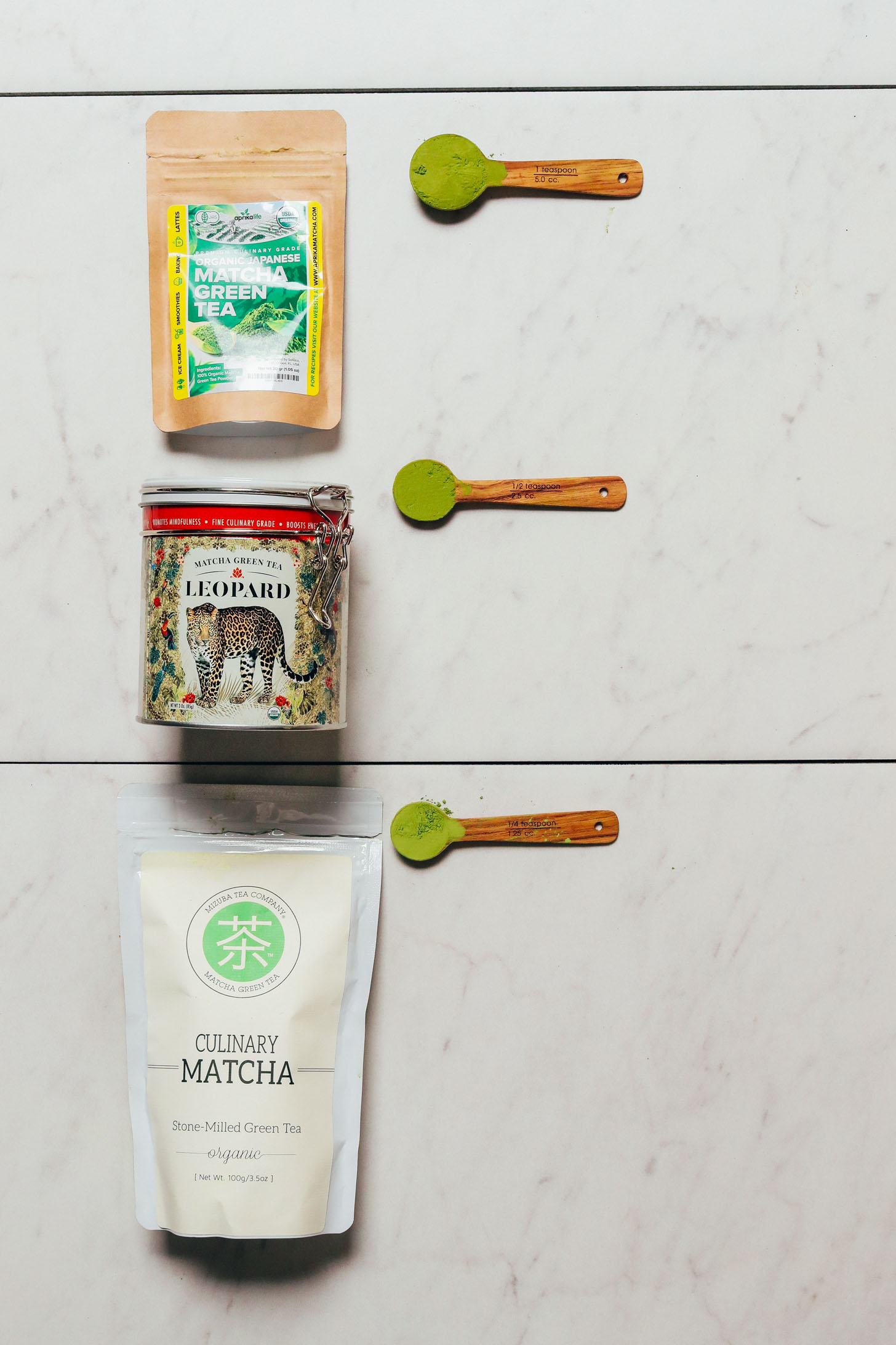 Spoonfuls and containers of our favorite brands of matcha