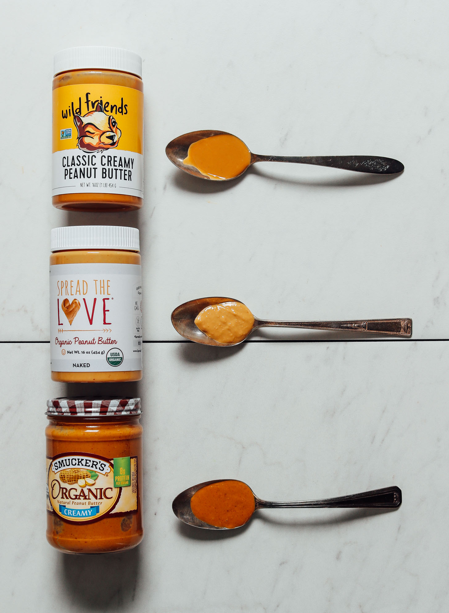 Jars and spoonfuls of our top three favorite brands of peanut butter