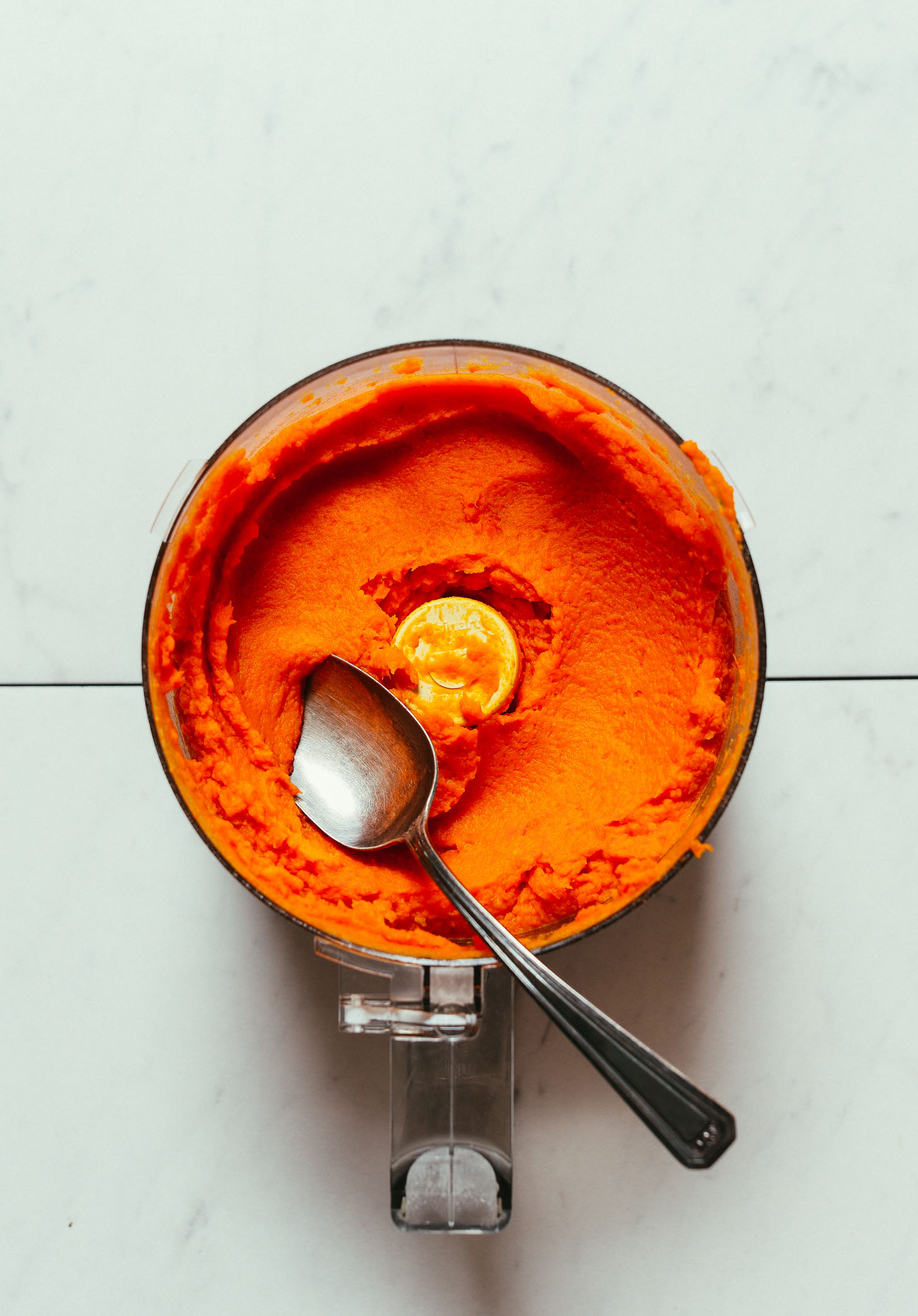 Food processor filled with our Mashed Sweet Potatoes and Carrots recipe