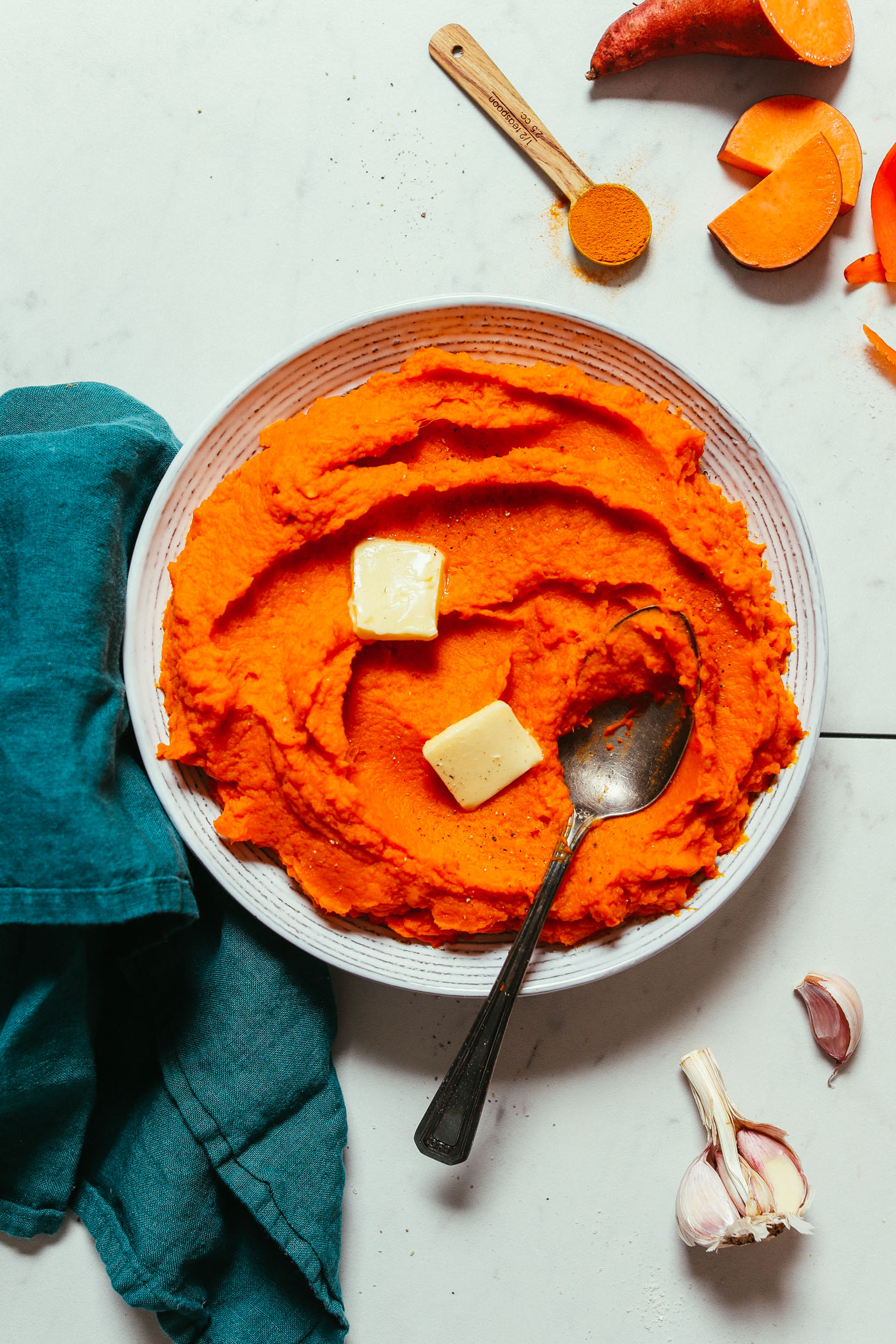 Bowl of healthy Mashed Sweet Potatoes and Carrots made with turmeric and garlic