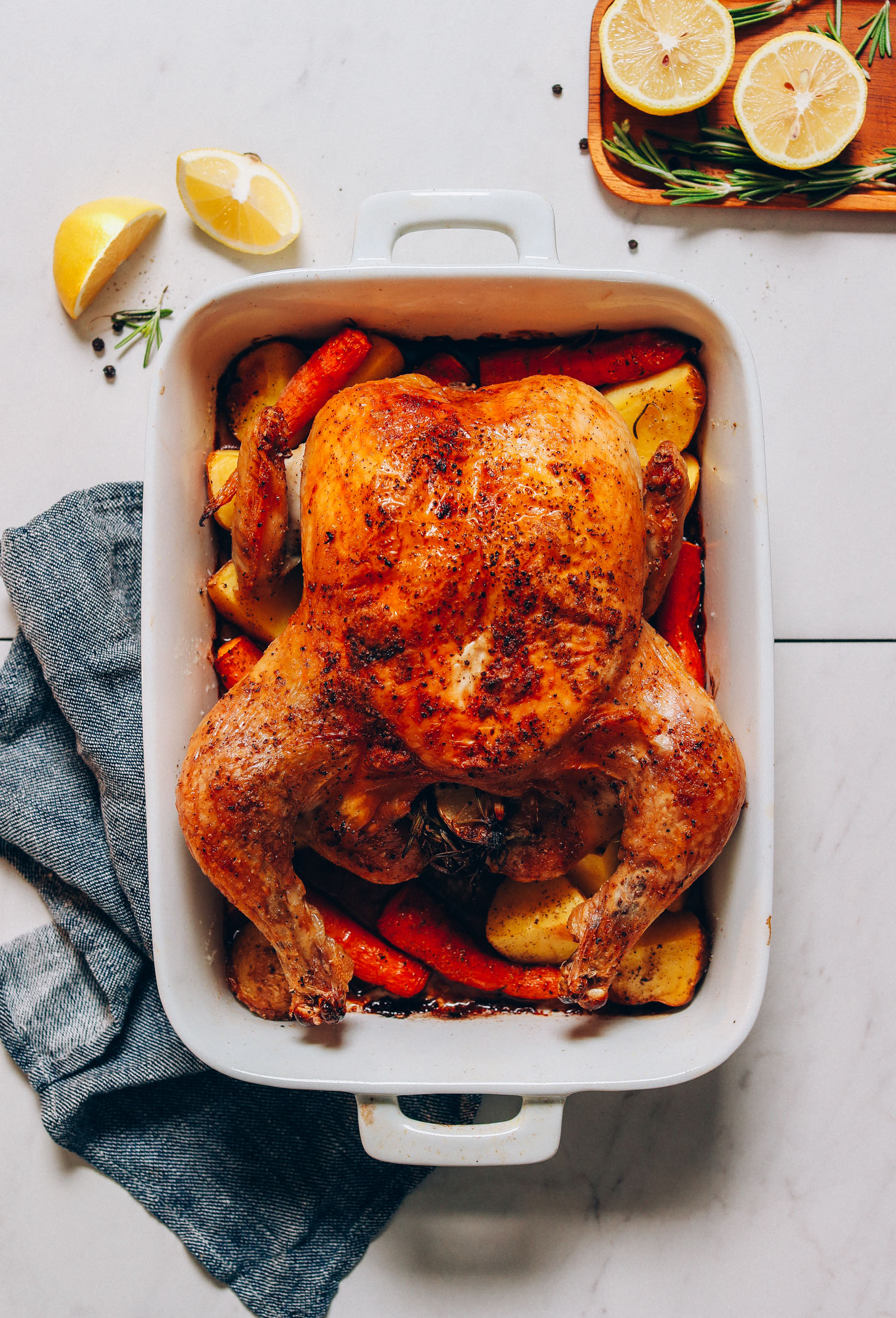 Perfectly cooked Oven Roasted Chicken in a ceramic dish