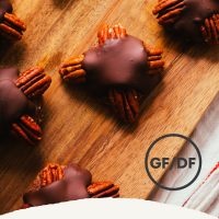 Cutting board of homemade Vegan Chocolate Turtle candies