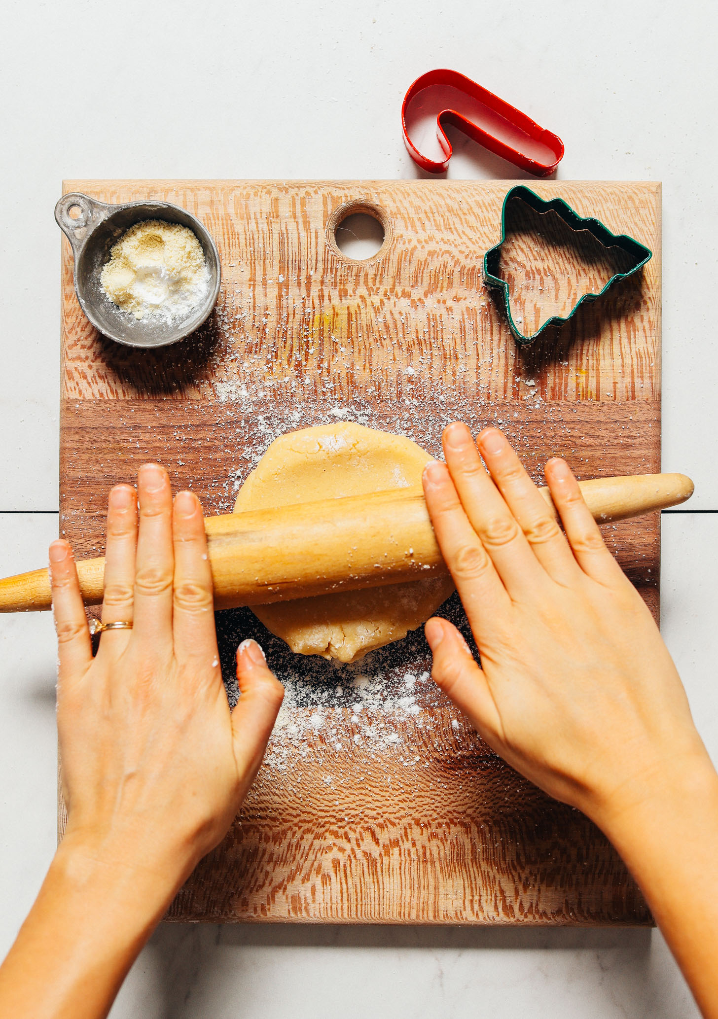 Using a rolling pin to roll out the dough for making our Grain-Free Sugar Cookie recipe