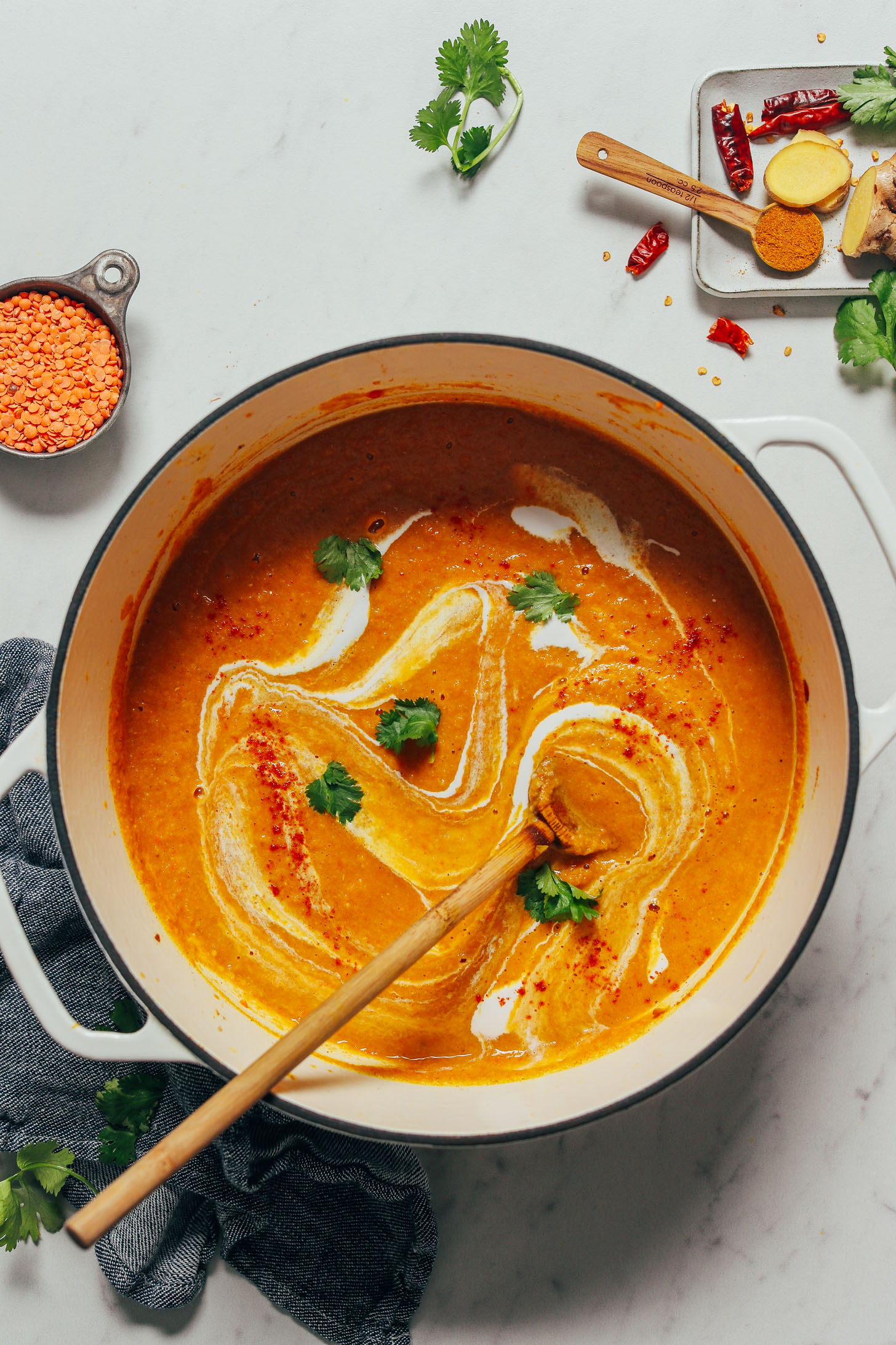 Spoon resting in a pot of our Creamy Vegan Curried Cauliflower Soup