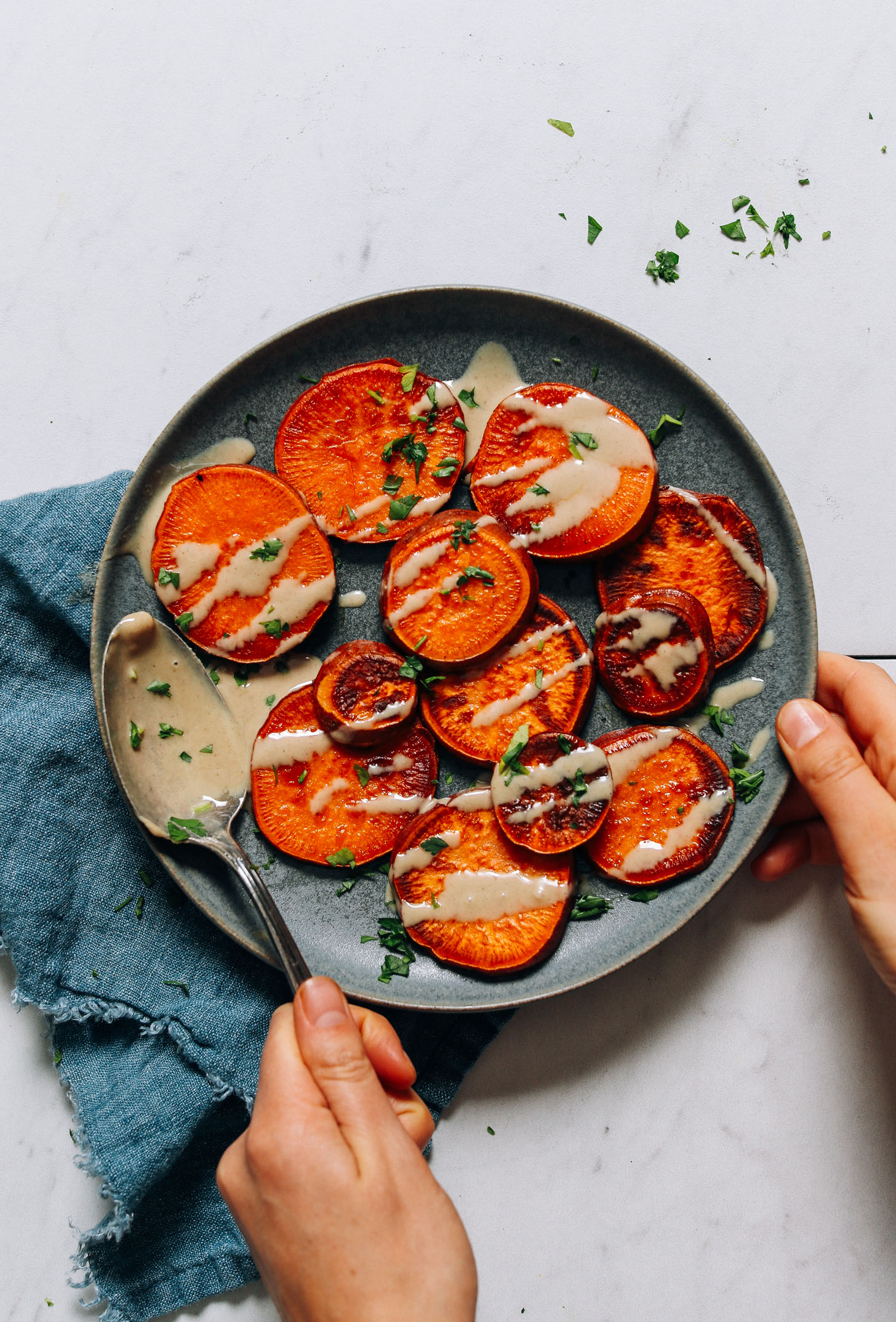 Plate of sliced sweet potatoes cooked on the stovetop