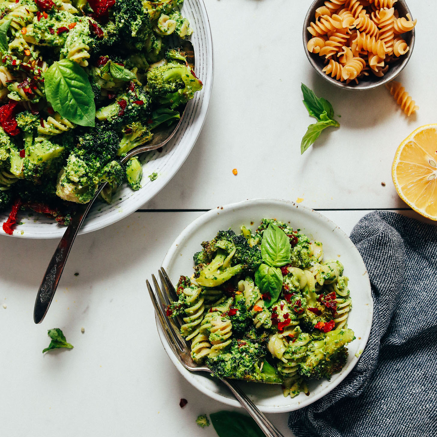 Bowls of Broccoli Pesto Pasta Salad made with gluten-free pasta