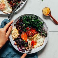 Cutting into an egg in our Simple But Good Breakfast Bowl