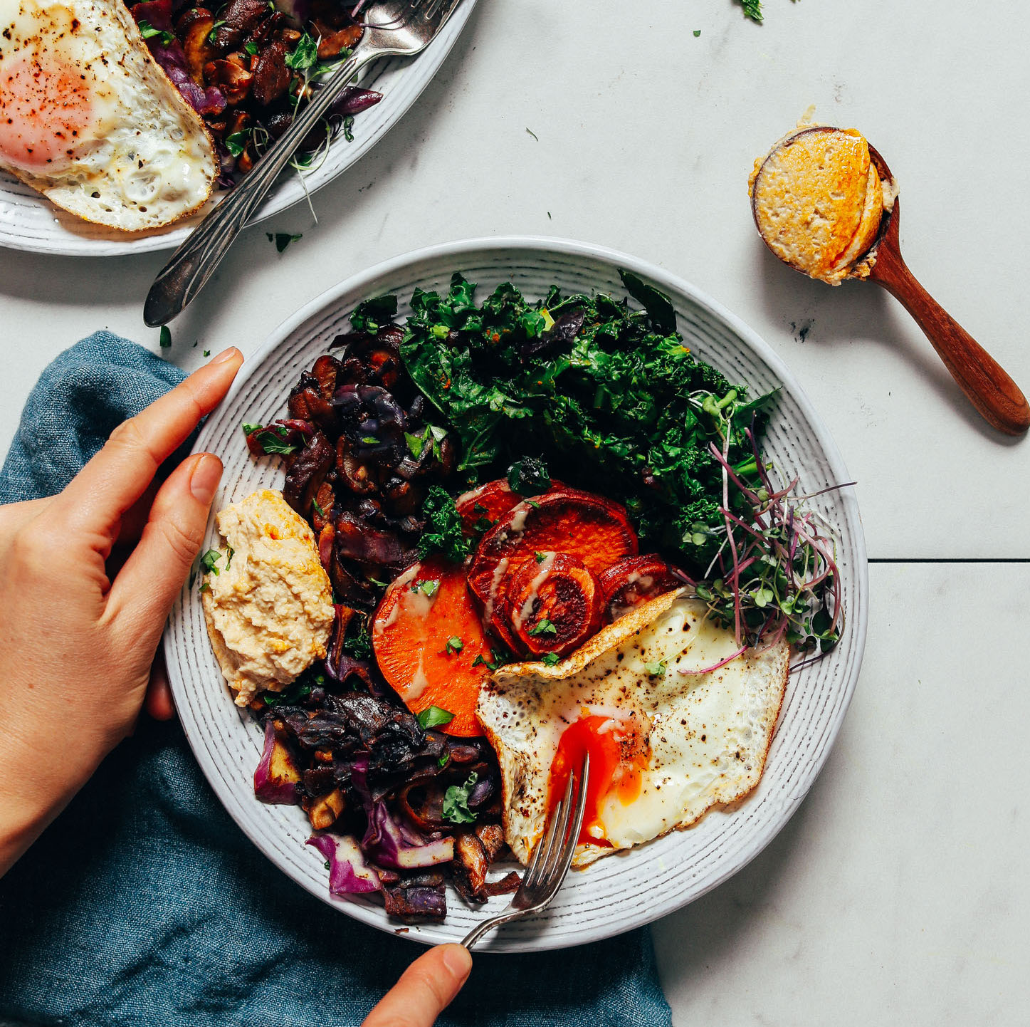 Cutting into an egg in our Simple But Good Breakfast Bowl