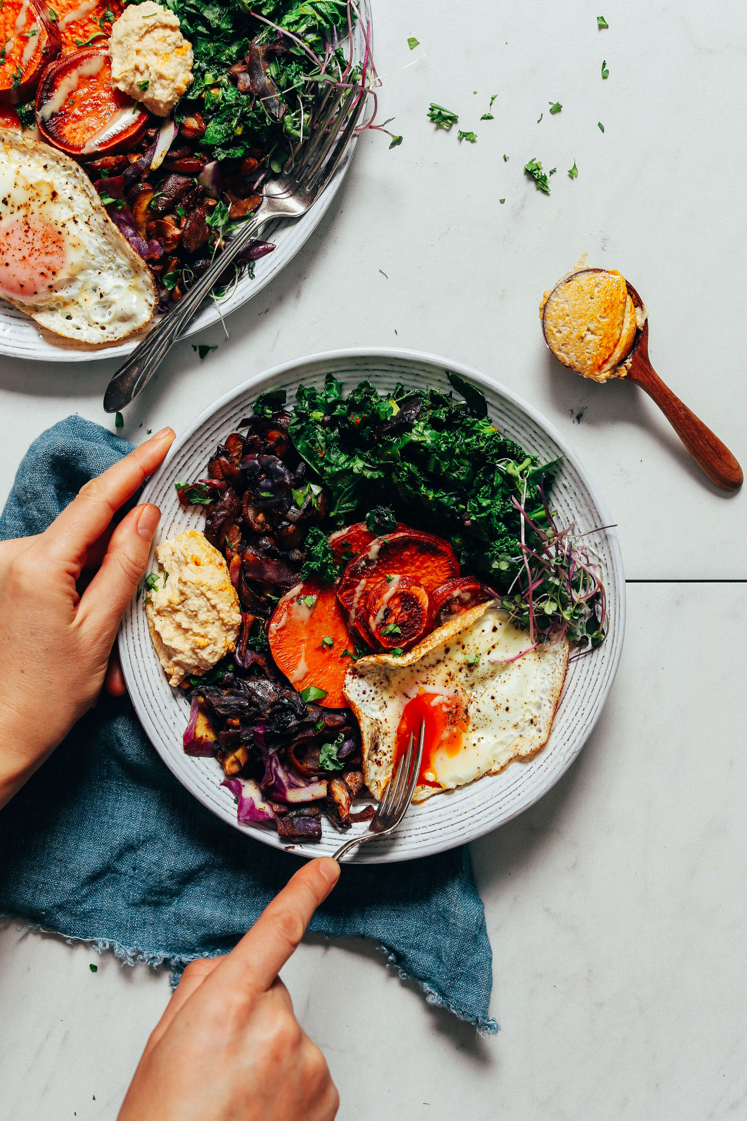 Slicing a fork into a bite of our Simple But Good Breakfast Bowl recipe