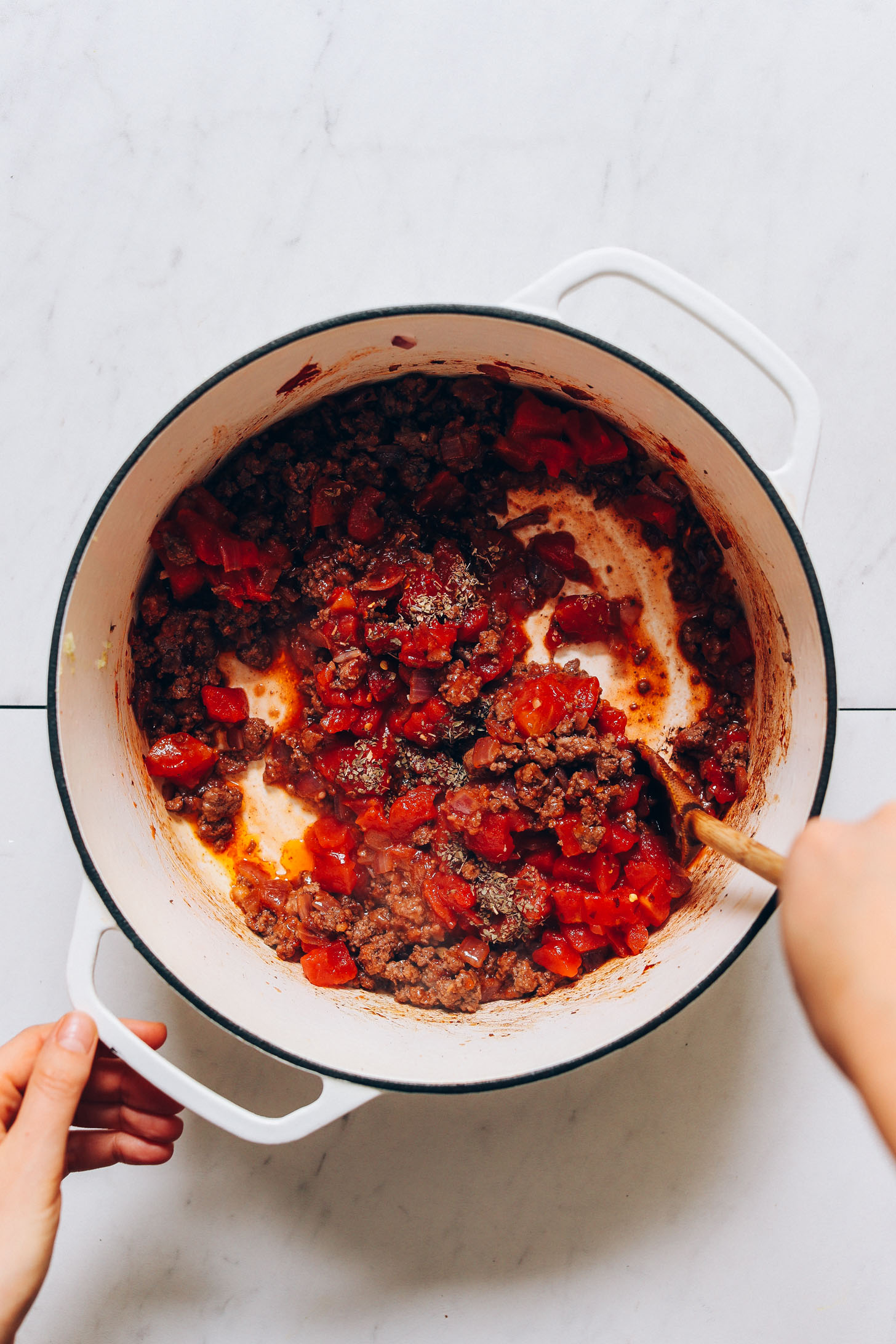 Stirring the ground beef and tomatoes for our Tuscan-Style Beef & Lentil Soup recipe