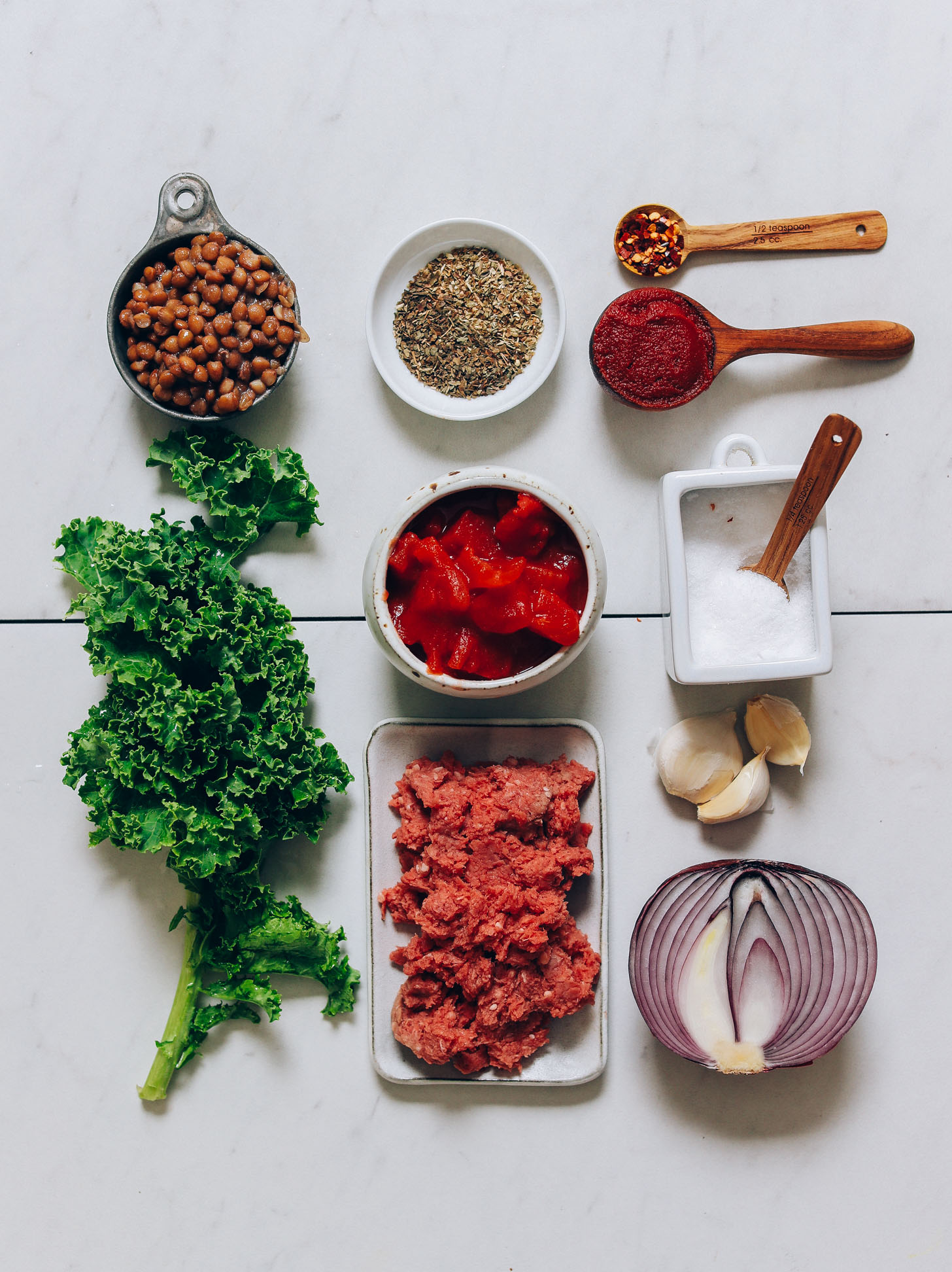 Kale, lentils, tomatoes, herbs, onion, garlic, salt, and ground beef for making our Tuscan-Style Beef & Lentil Soup.