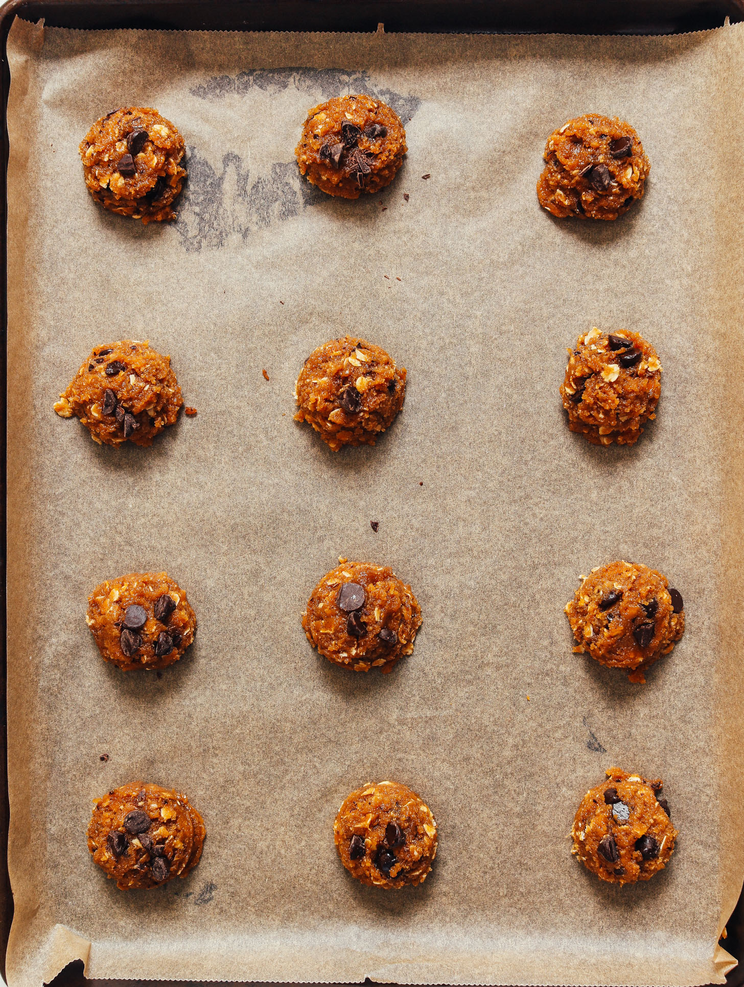 Baking sheet of unbaked Peanut Butter Chocolate Chip Cookies