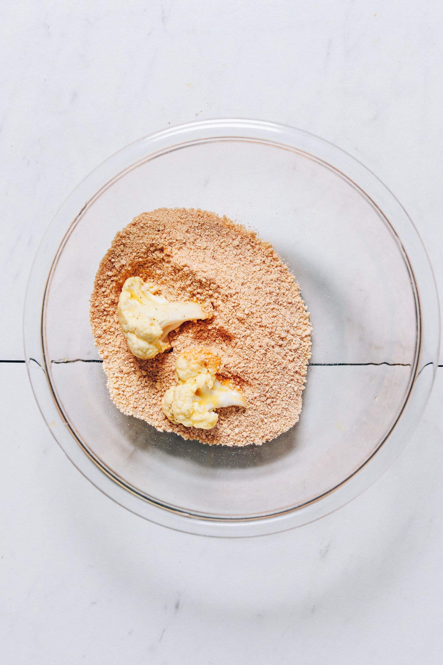 Cauliflower florets in cashew breading mixture