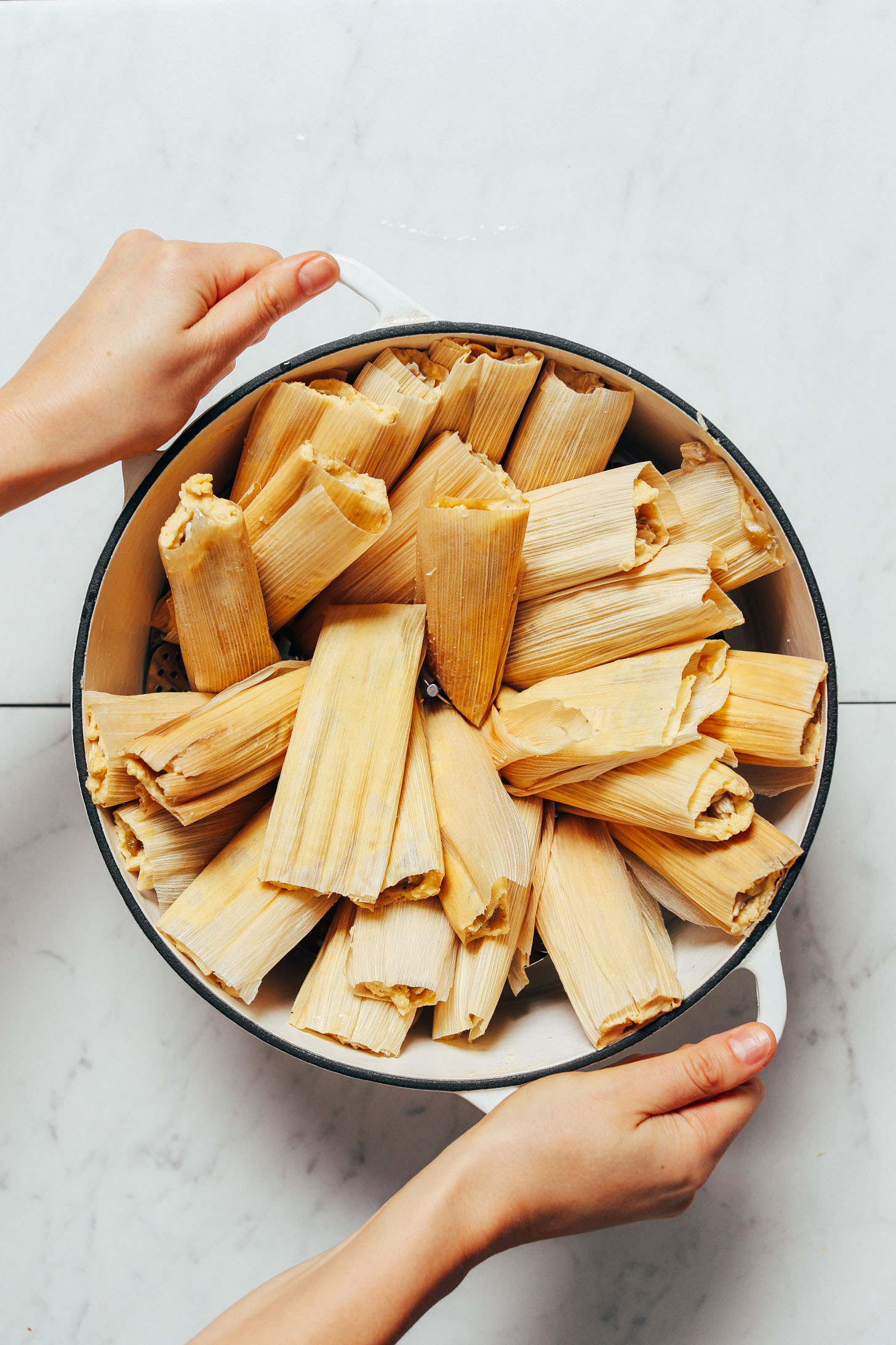 Pot of Green Chili Chicken Tamales ready to be cooked