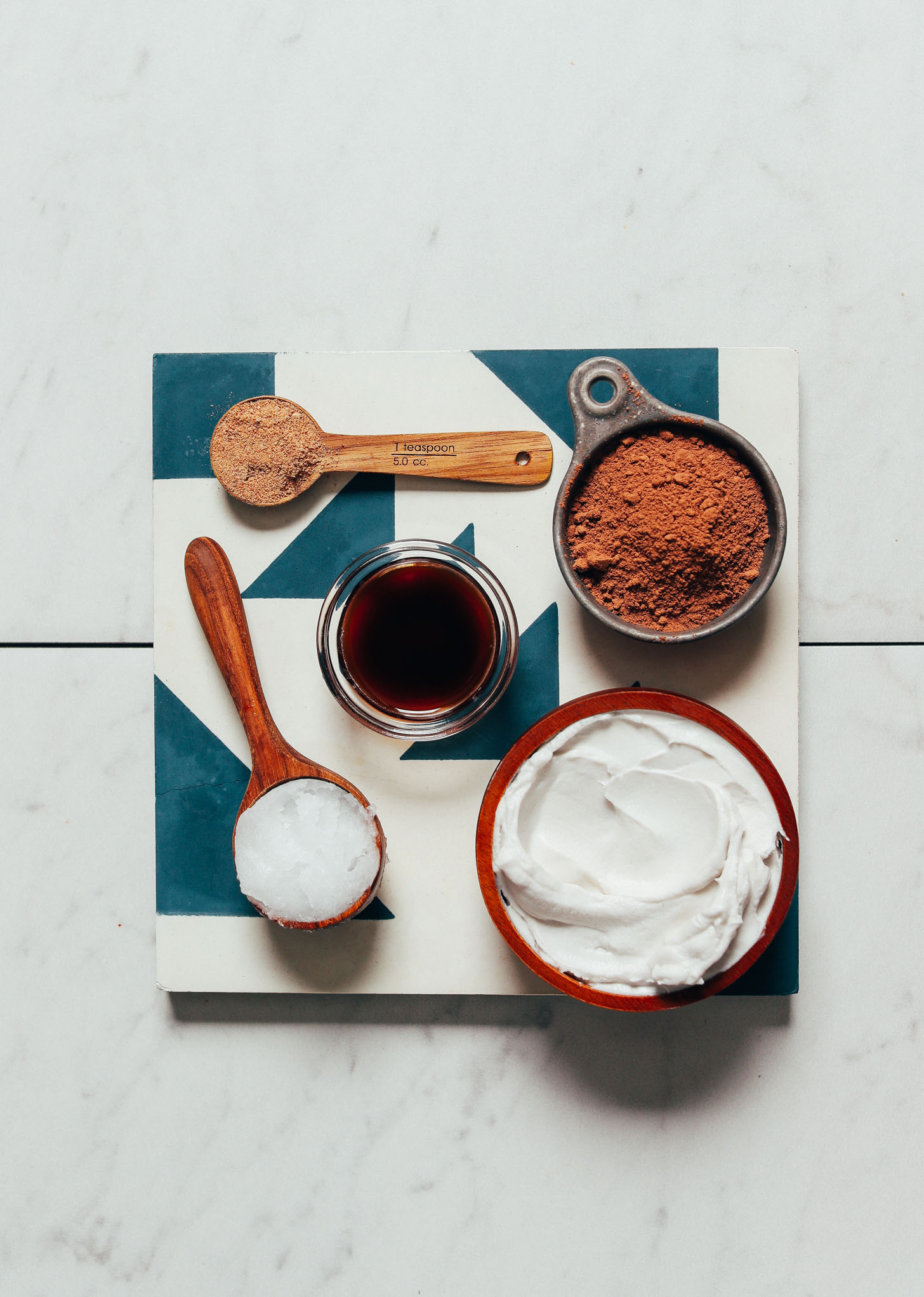 Coconut cream, cacao powder, coconut oil, and other ingredients for making our homemade Vegan Milk Chocolate Recipe